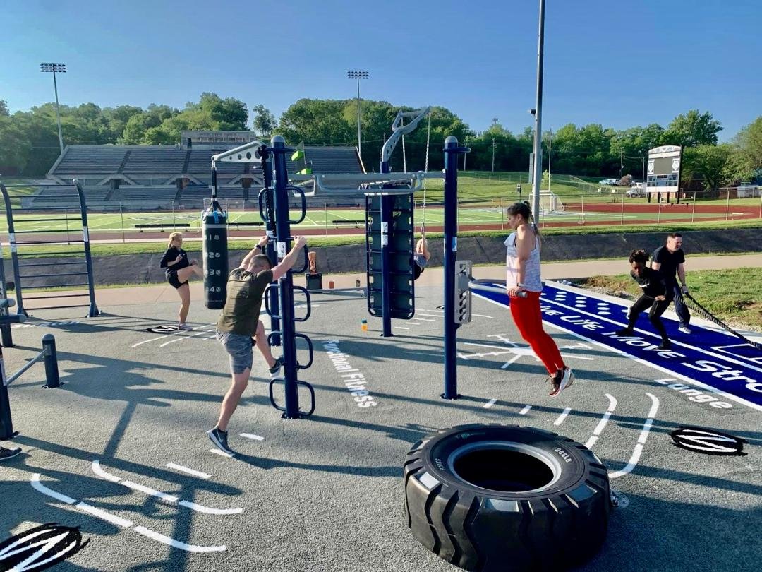 Athletes on outdoor fitness site