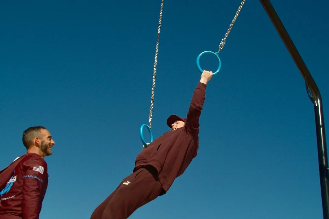 student using traveling rings