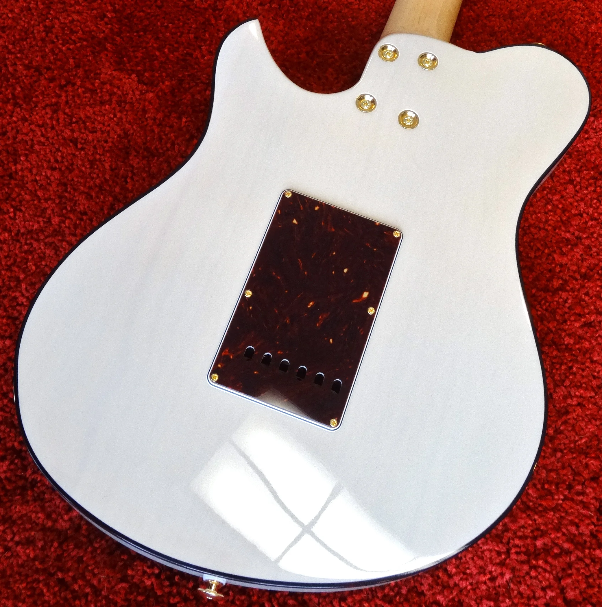 There's so much depth and warmth to the finish, and you can just see the grain of the one-piece pine body.