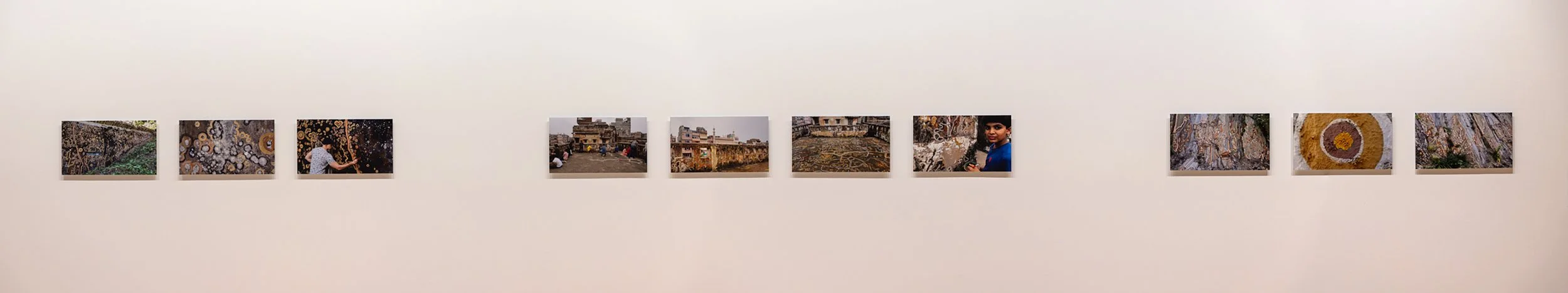  Documentation of previous earth murals, including:  Lecanora Muralis , Ilhabela, Brazil, 2017 (left);  मिटटी सिटी Mitti City , Jaipur, India, 2018 (centre); and  Farrera , Catalonian Pyrenees, 2019 (right). Photo documentation by Cole Swanson and An