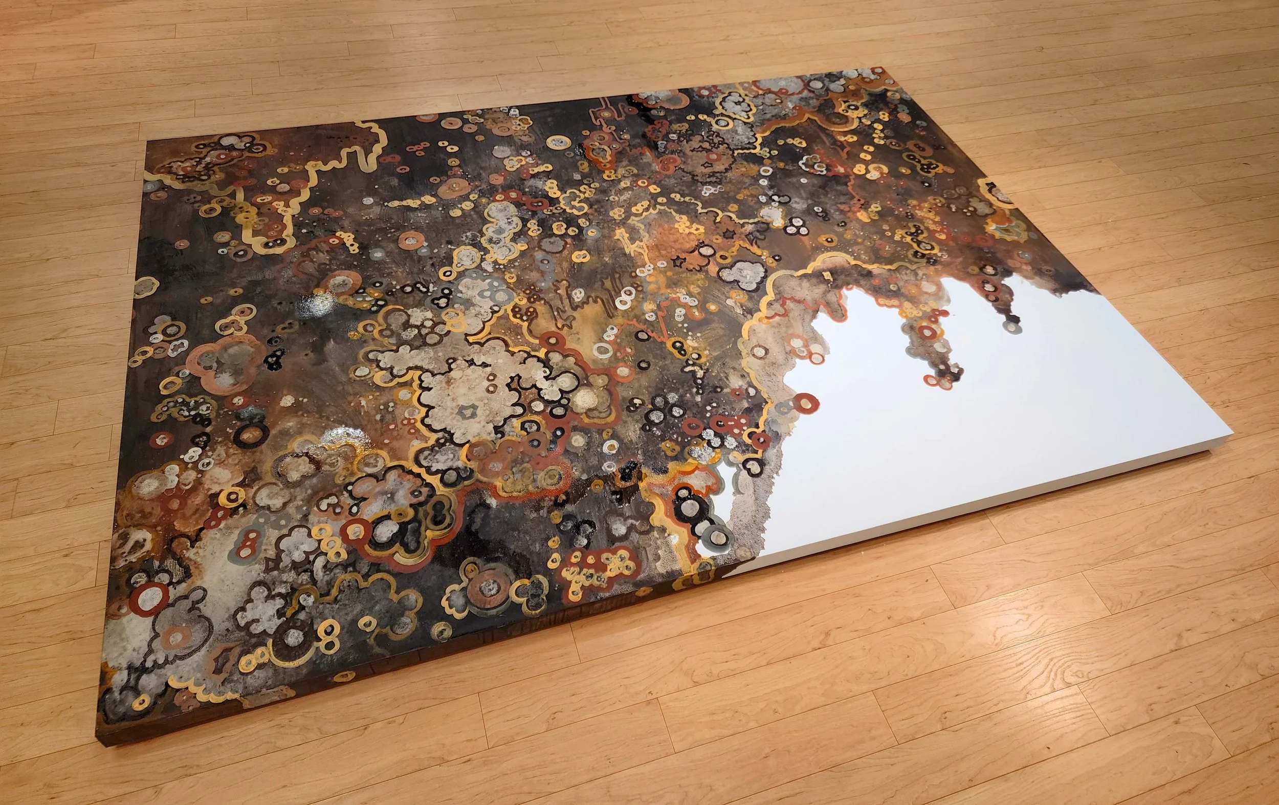   land/form , hand-prepared mineral colours on gallery plinth, 2026. Photo documentation by Cole Swanson.  