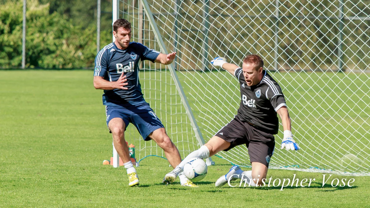 Vancouver Whitecaps FC centre back Martín Bonjour and goalkeeping coach Marius Røvde practice at Inter River Park on 7 September 2012.