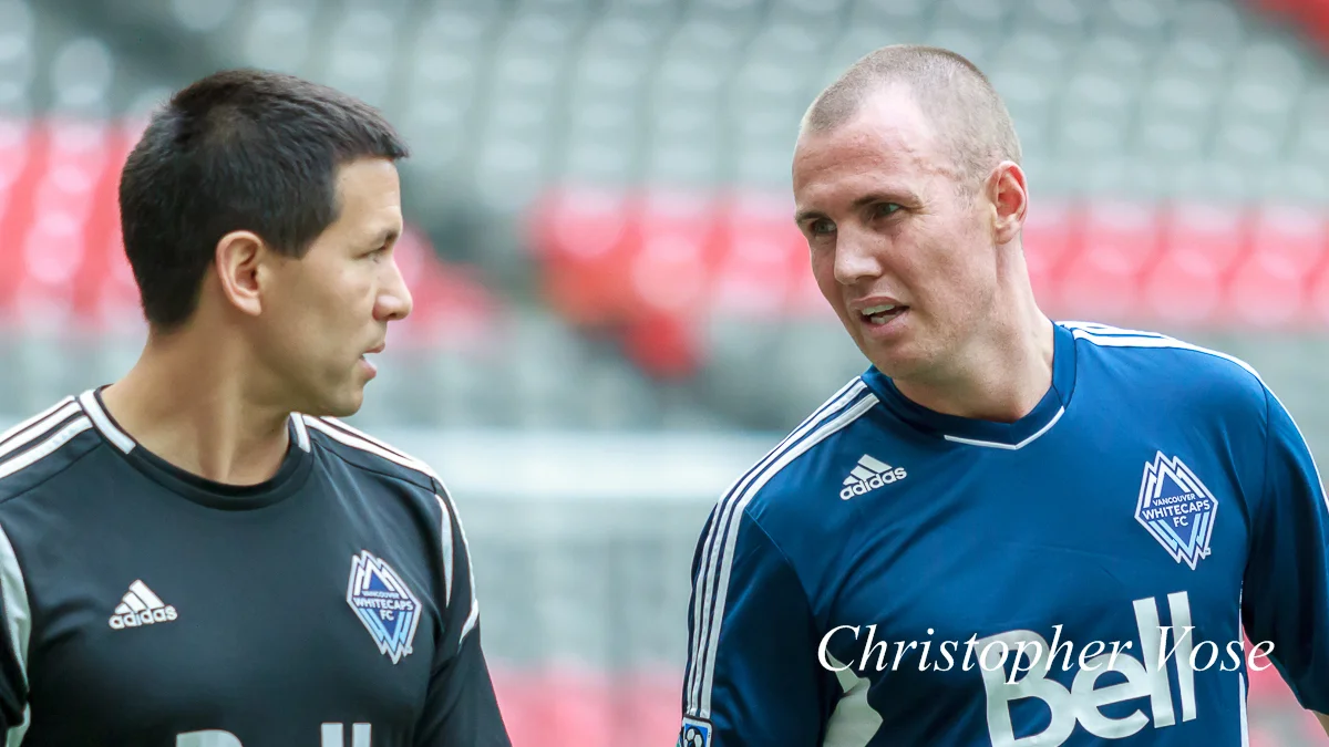 Mike Young discusses fitness issues with Kenny Miller at BC Place on 17 July 2012.