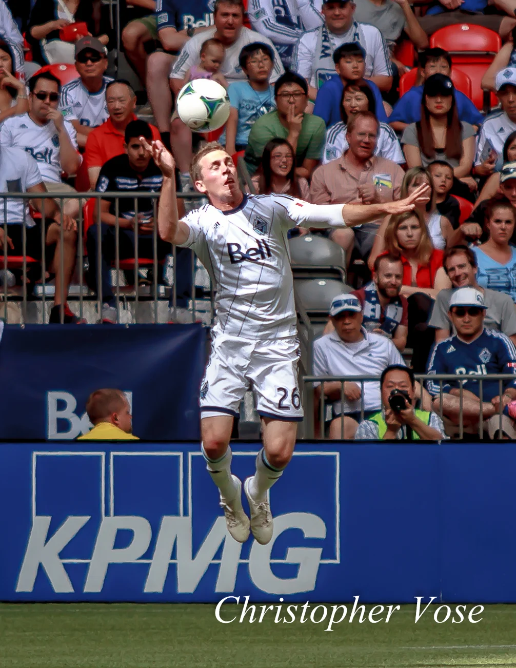 Corey Hertzog heads the ball at BC Place on 14 July 2013.