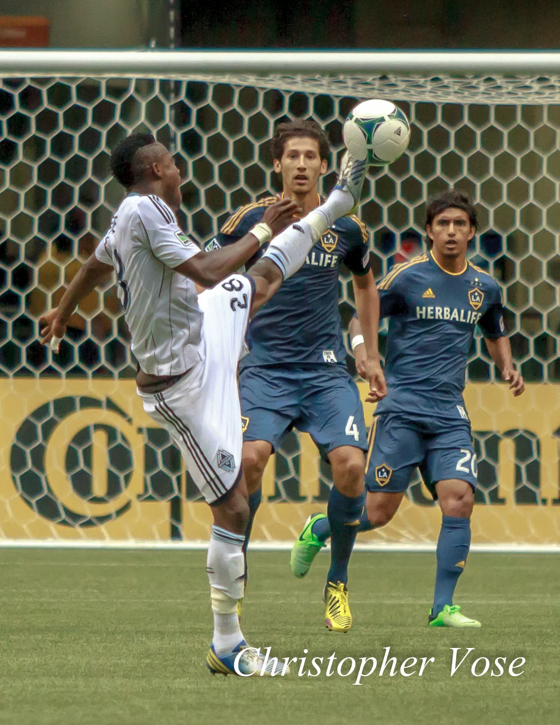 Gershon Koffie shows off his athleticism to Omar Gonzalez and A.J. DeLaGarza at BC Place on 11 May 2013.