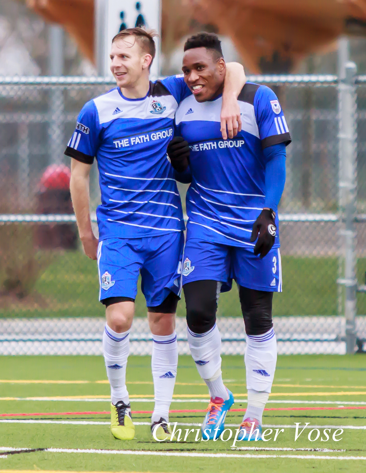 Neil Hlavaty celebrates with Eddie Edward after the Canadian defender made it 3-0.