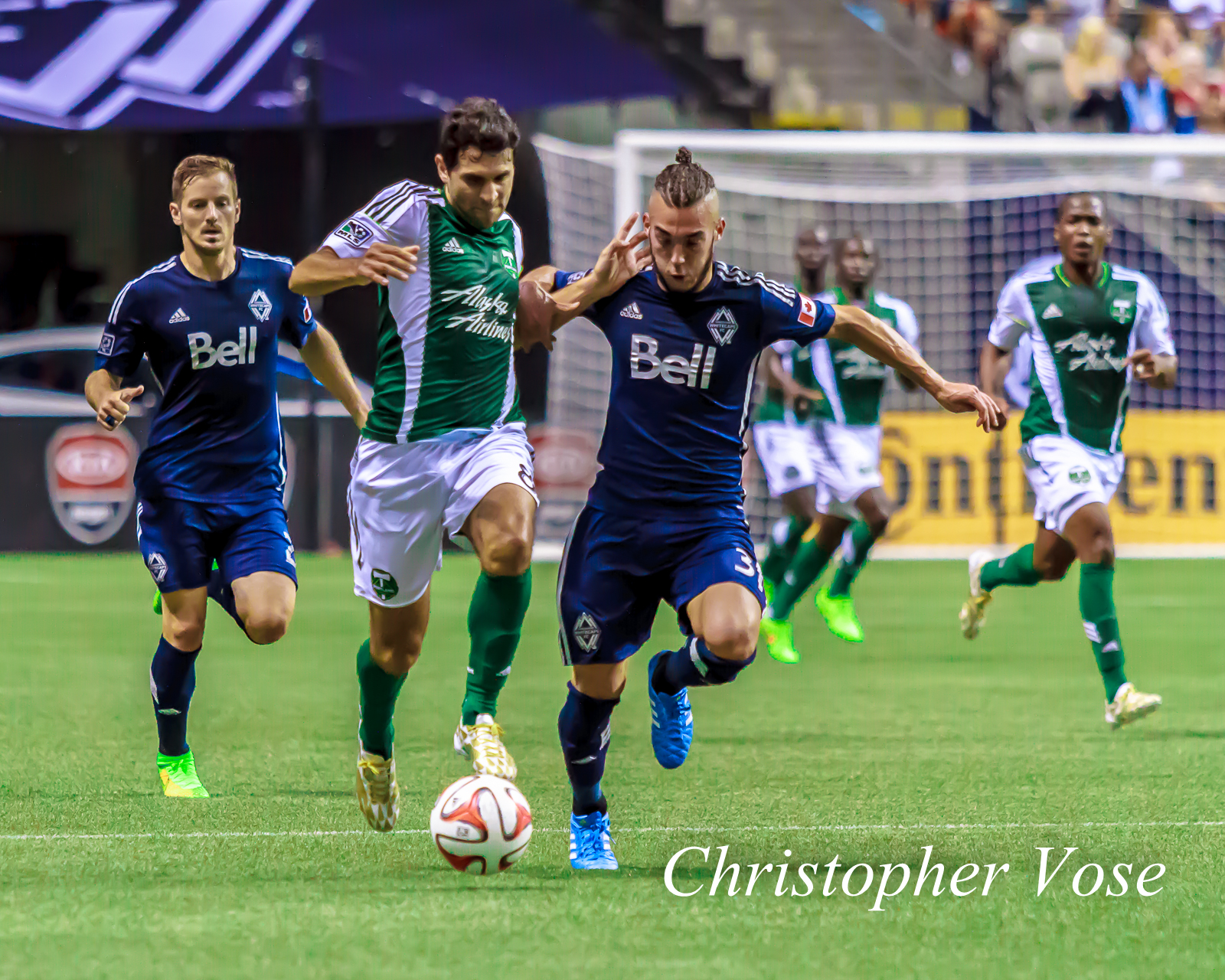 2014-08-30 Jordan Harvey, Diego Valeri, and Russell Teibert.jpg