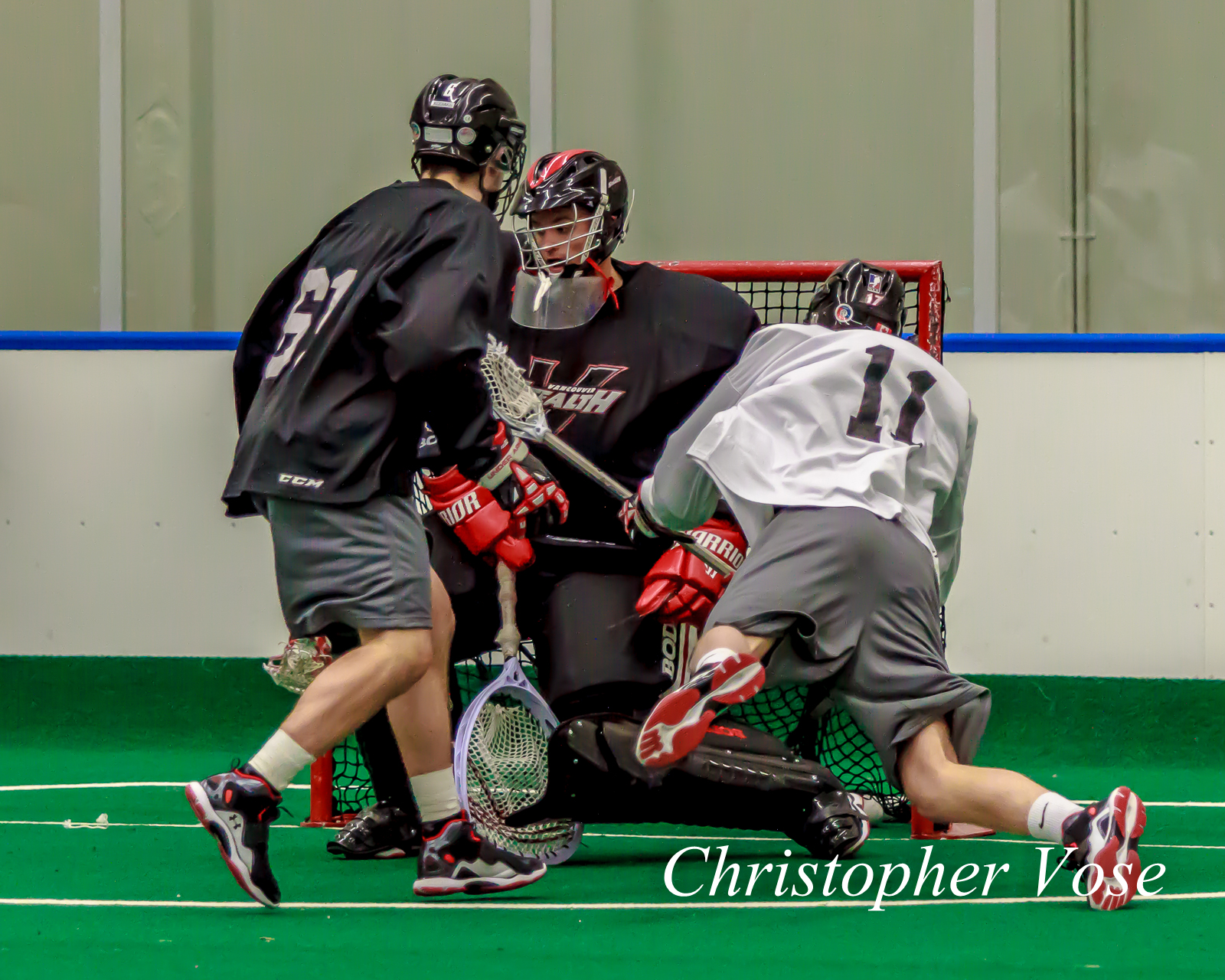 Chris Wardle goes in on Neil Tyacke as Bill Horstrawser watches at last year's training camp.