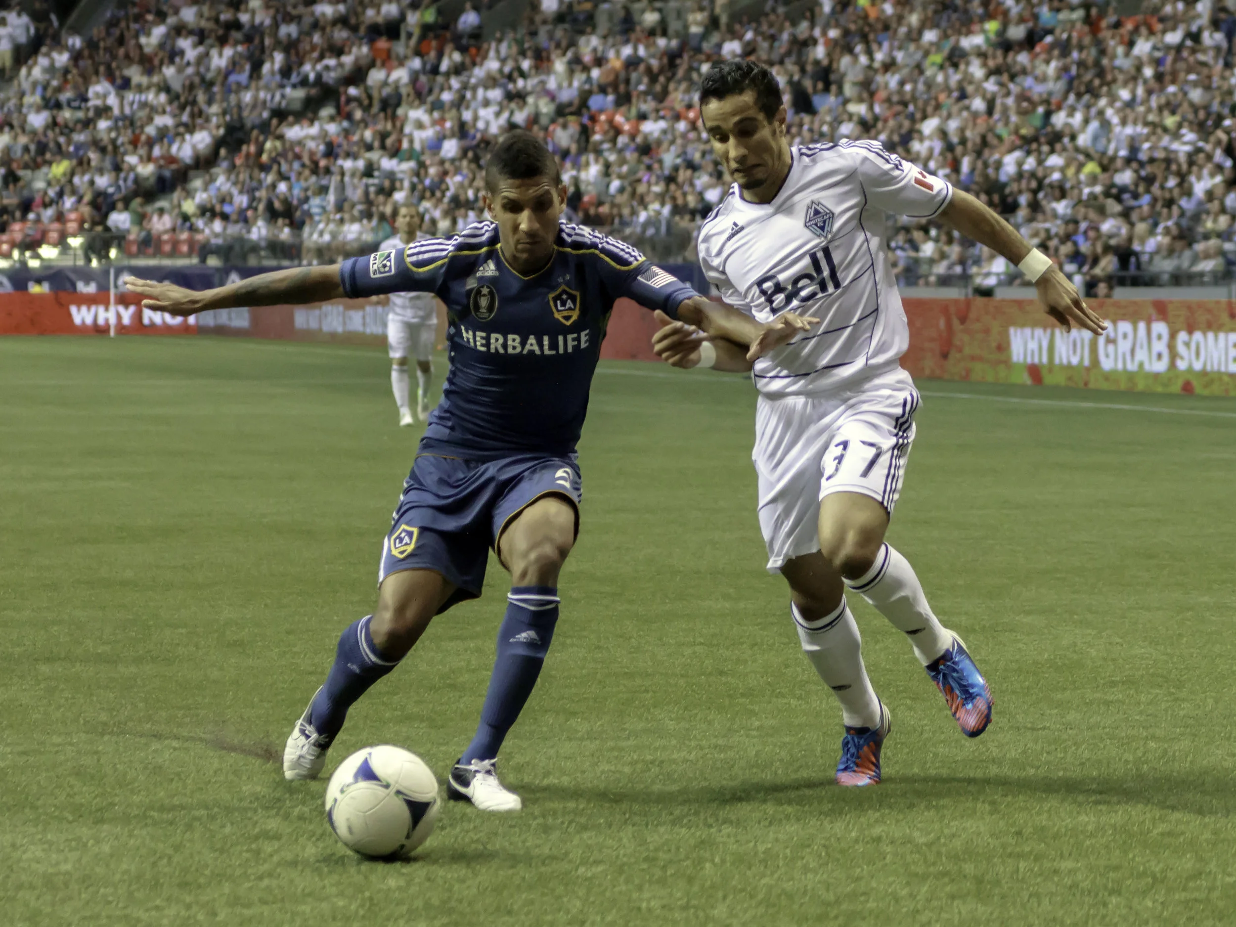 Sean Franklin holds off Camilo Sanvezzo in his first match at BC Place