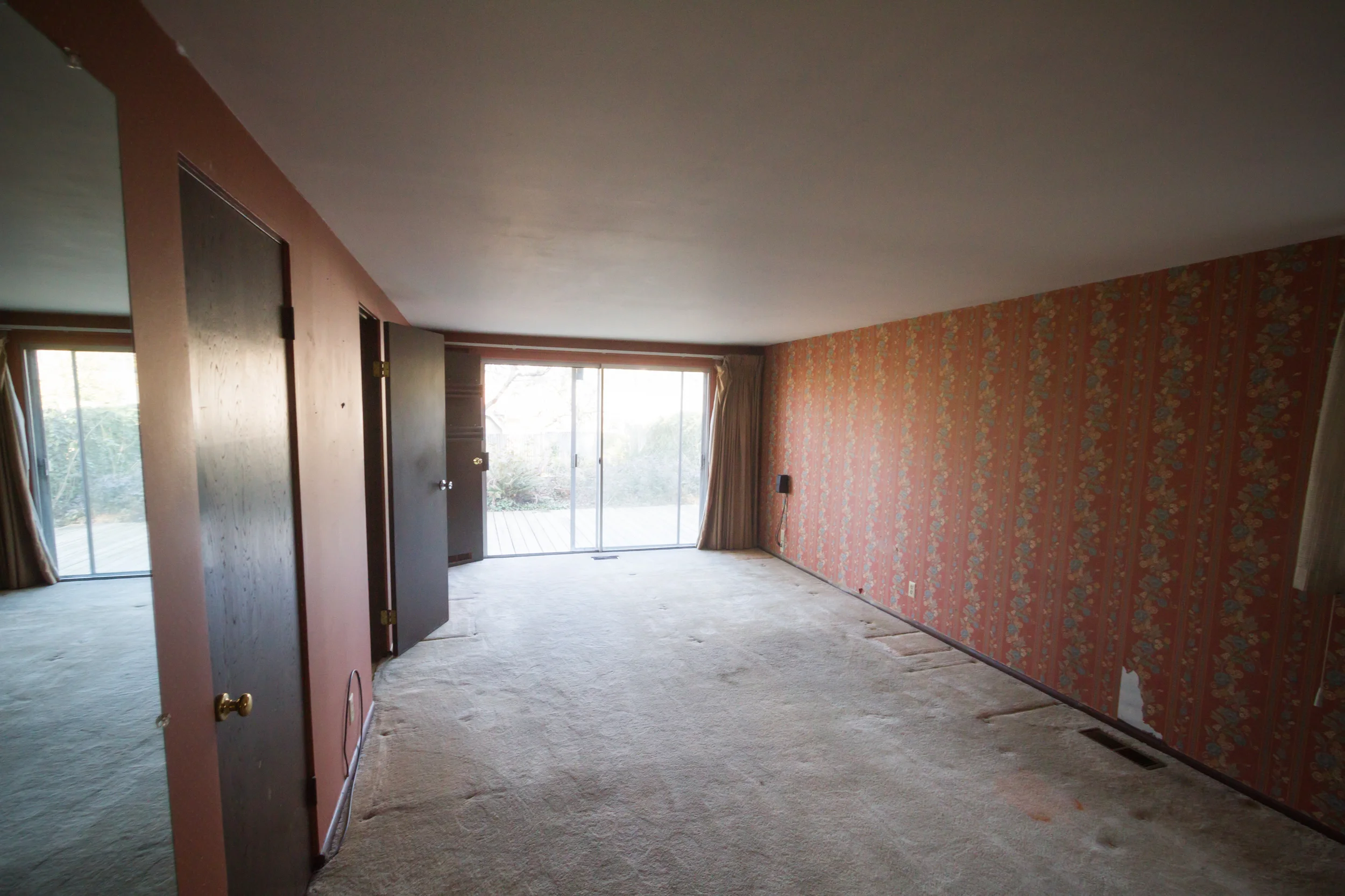 From the doorway to the bedroom. The wall to the right is the one with the second layer of wallpaper.