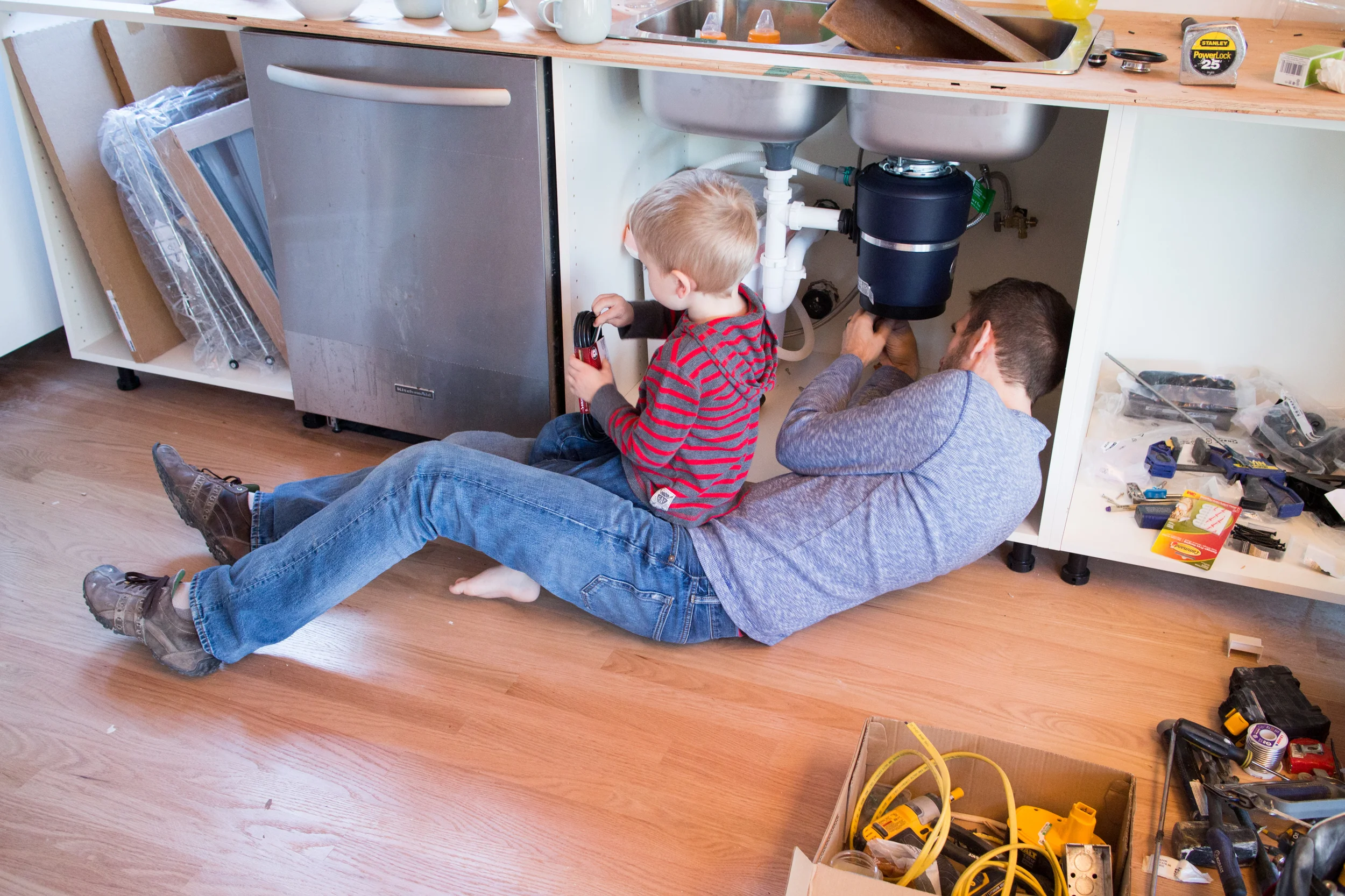 Michael had assistance with the garbage disposal.