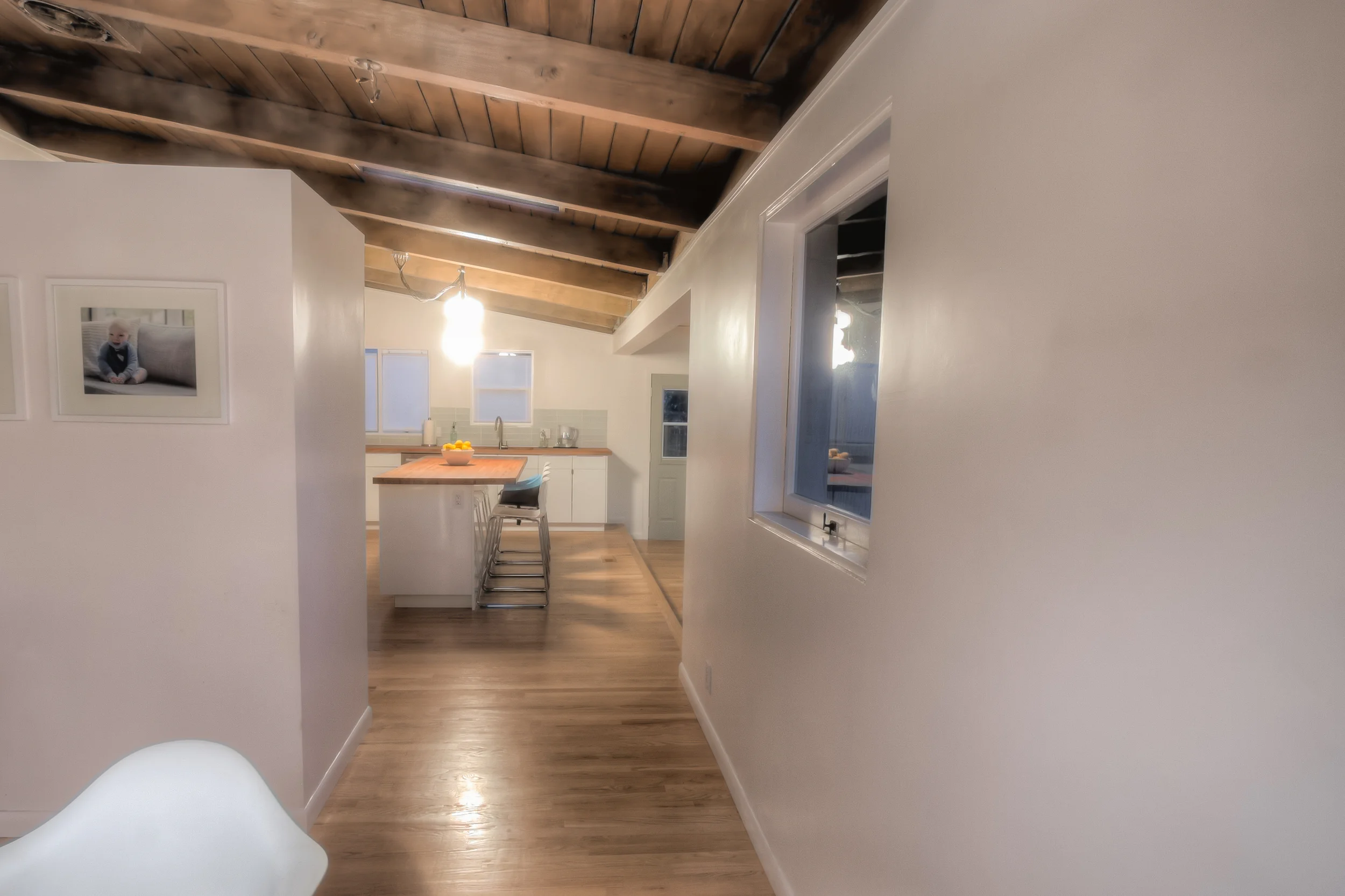 View from the dining room to the kitchen and sunroom. The window on the right used to be above the kitchen sink.