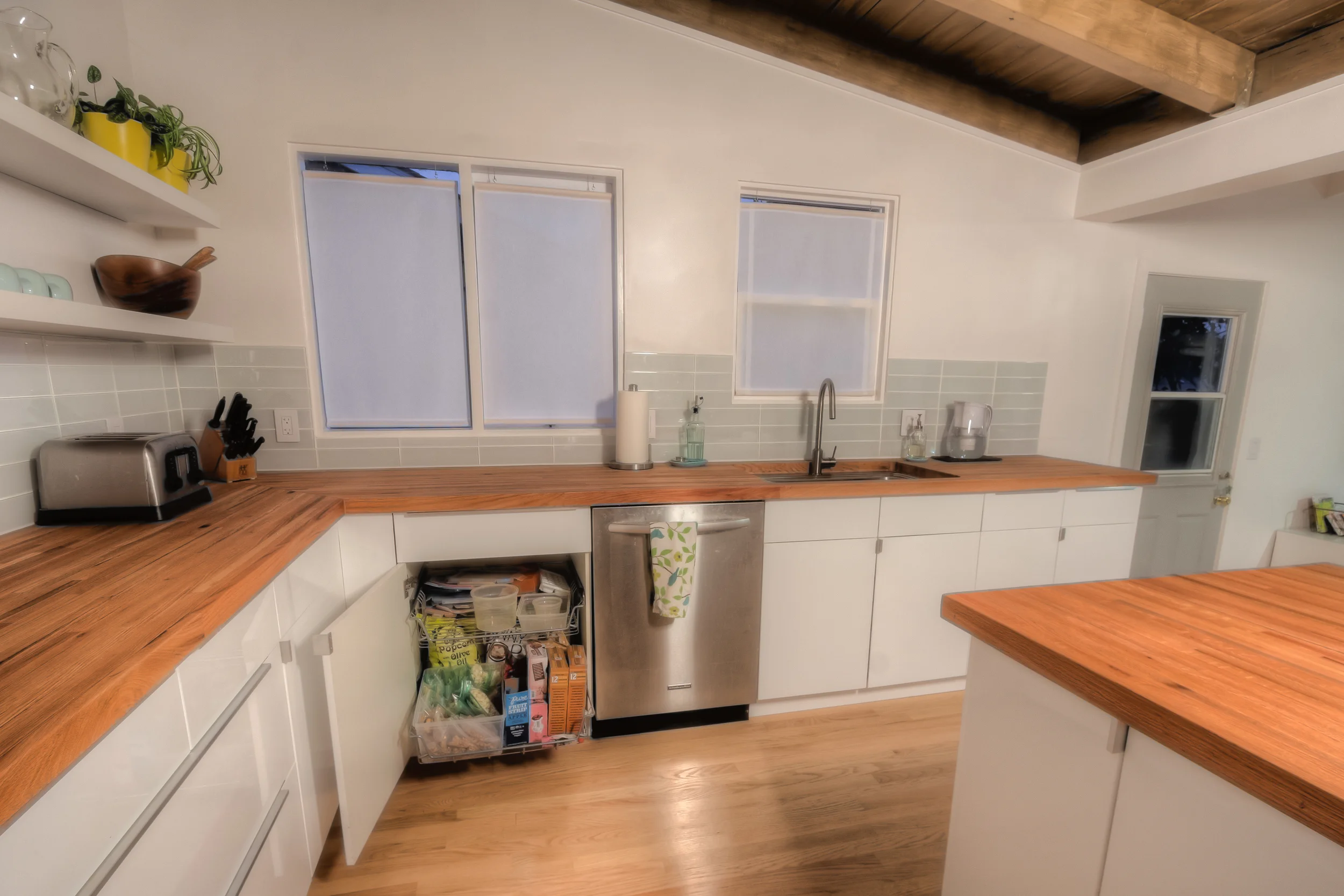 We put in lots of neat storage features. This holds tupperware and the kids' snacks.