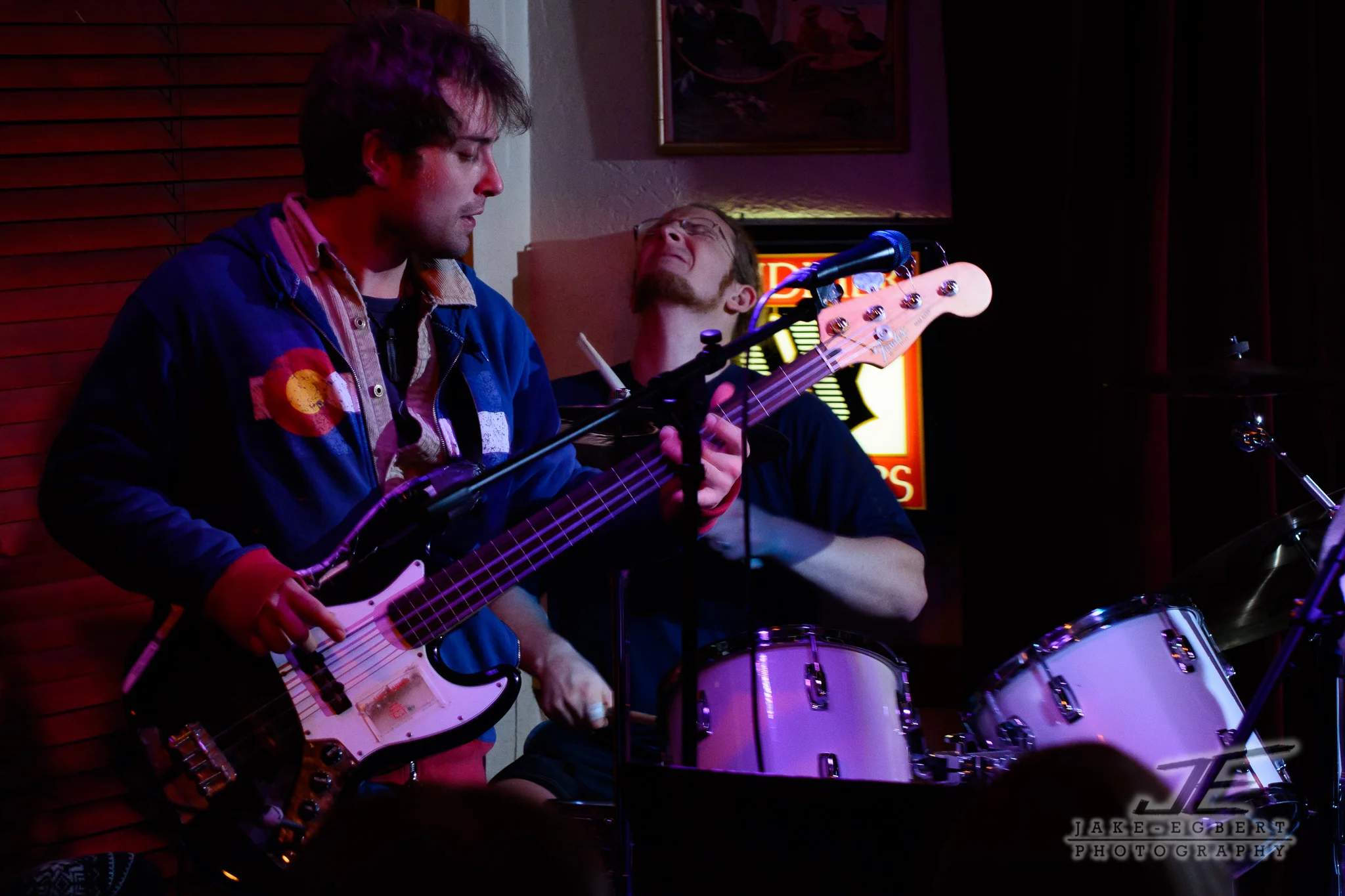 The flash set up on the right side of the frame cast some light back into the drummer's back corner. He's rockin' out back there! Matt Lauzon is listed as the drummer on their Facebook page...