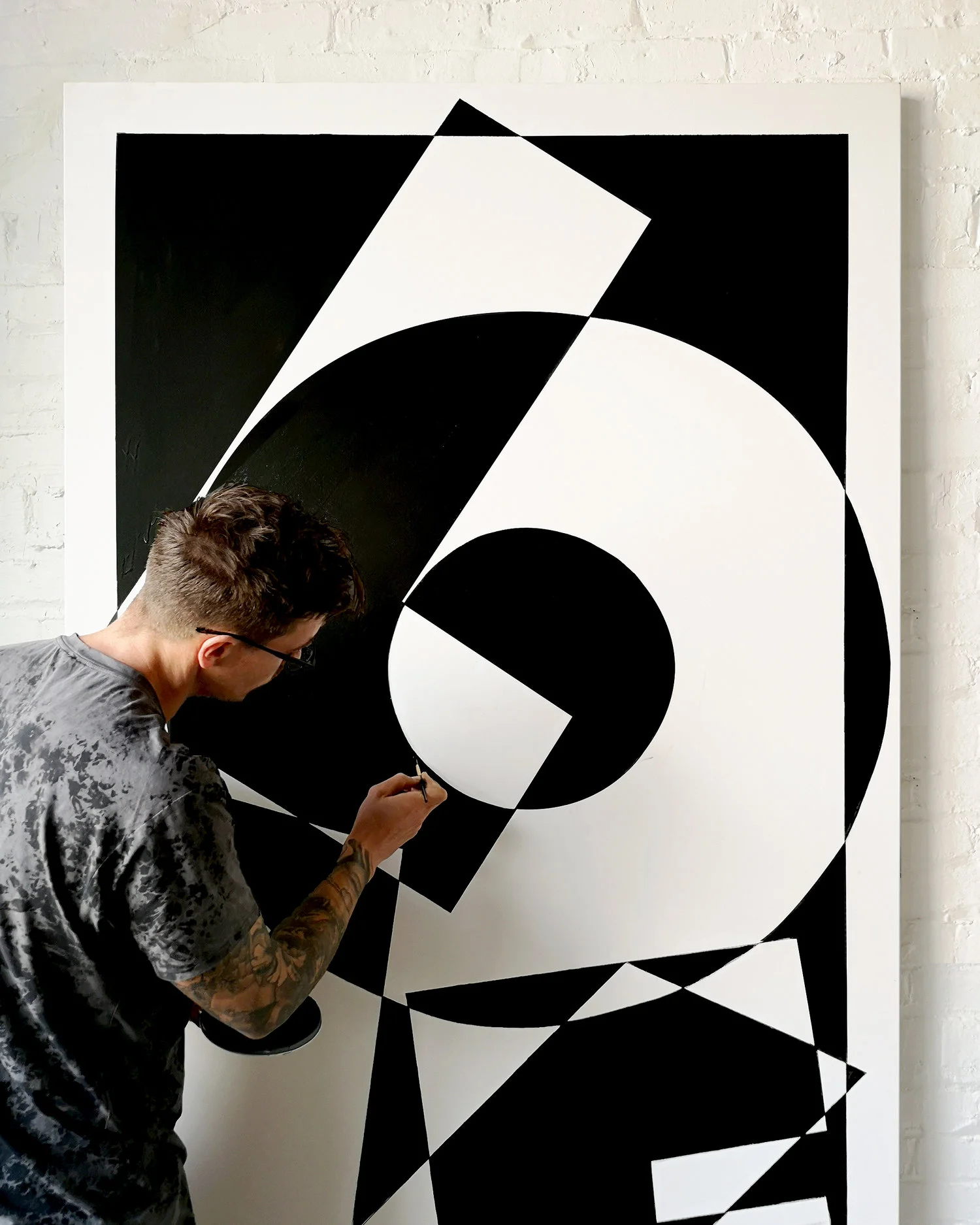 Image of Ben Johnston creating Love mural