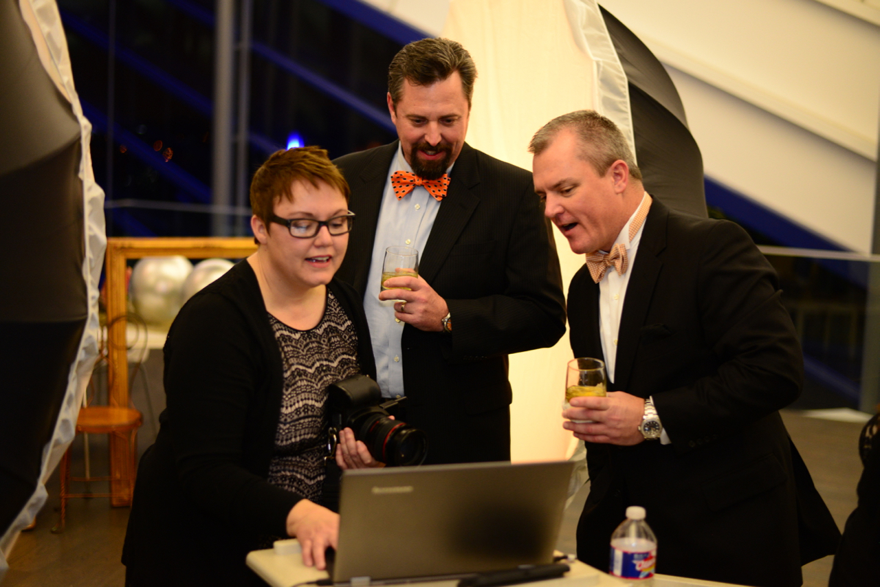 Guests sneaking a peek of their images BTS Photo credit Johnny Trammell