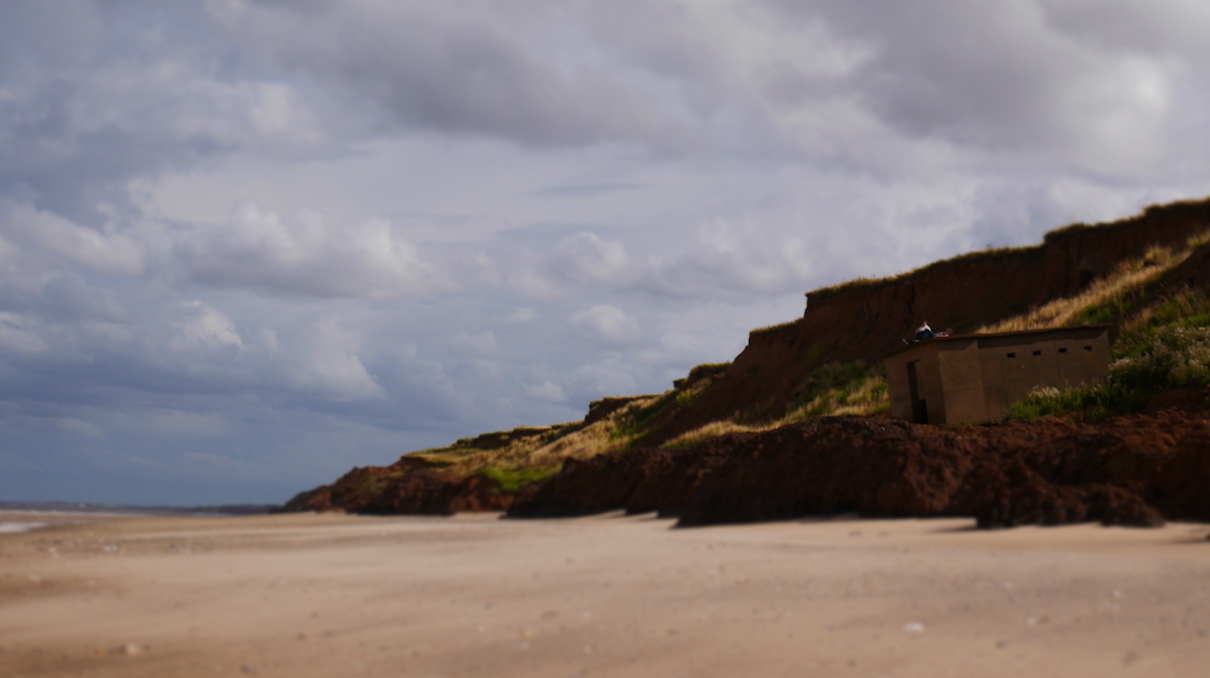 Still from The Morrow. Pillbox on cliff edge