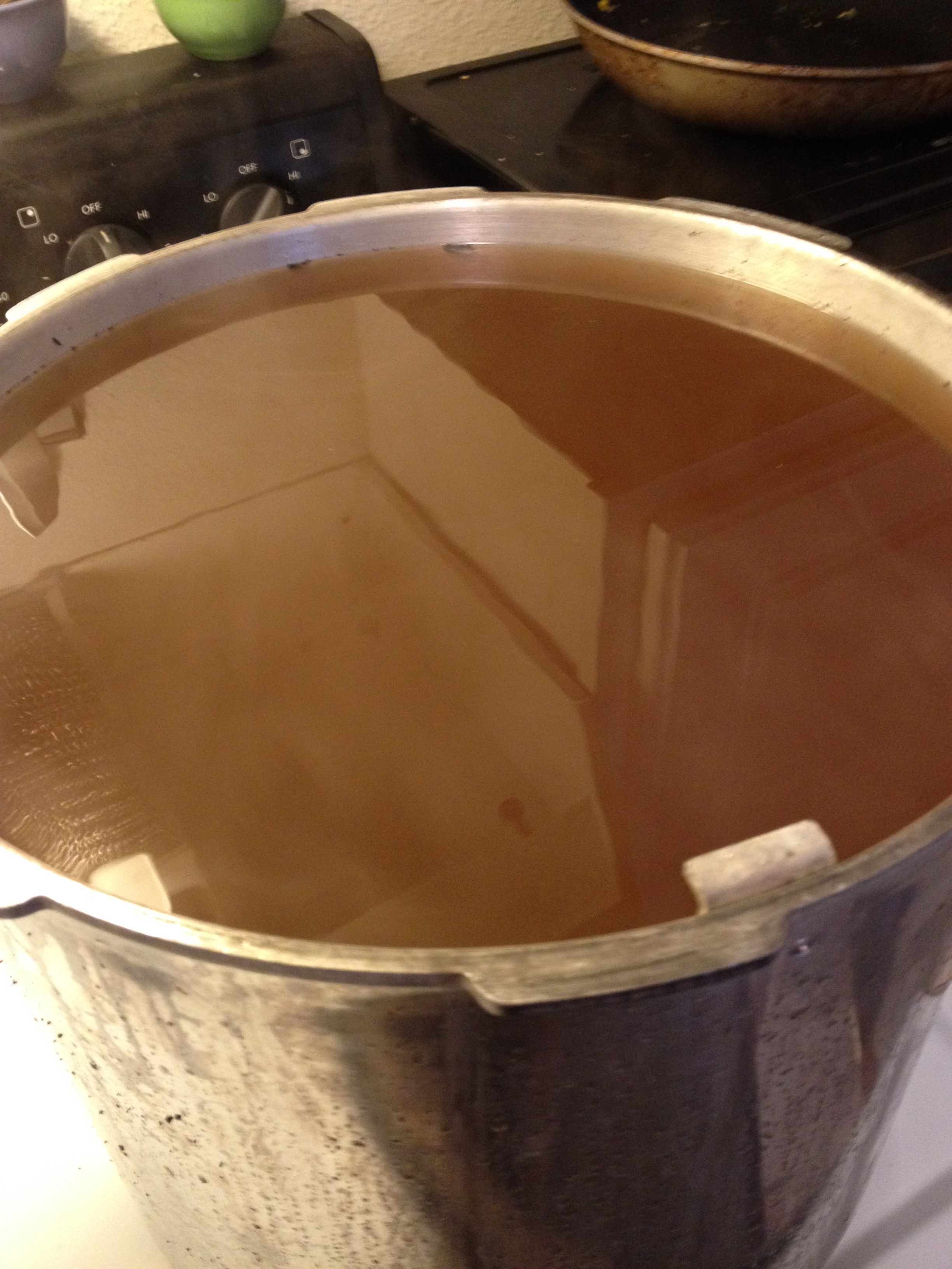 Then it is time to switch to the stove and more boiling! Sap starts out clear with barely a slight yellow tinge but by now it's boiled down to this deep caramel color.