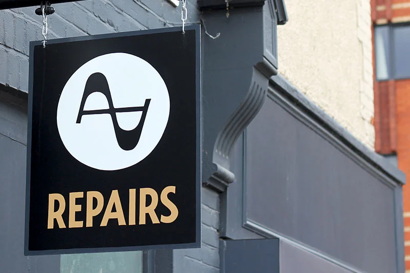 3-hanging-sign-armstrong-audio-luminor-sign-co-ged-palmer-sign-painting-lettering-fascia-hand-painted-branding.jpg