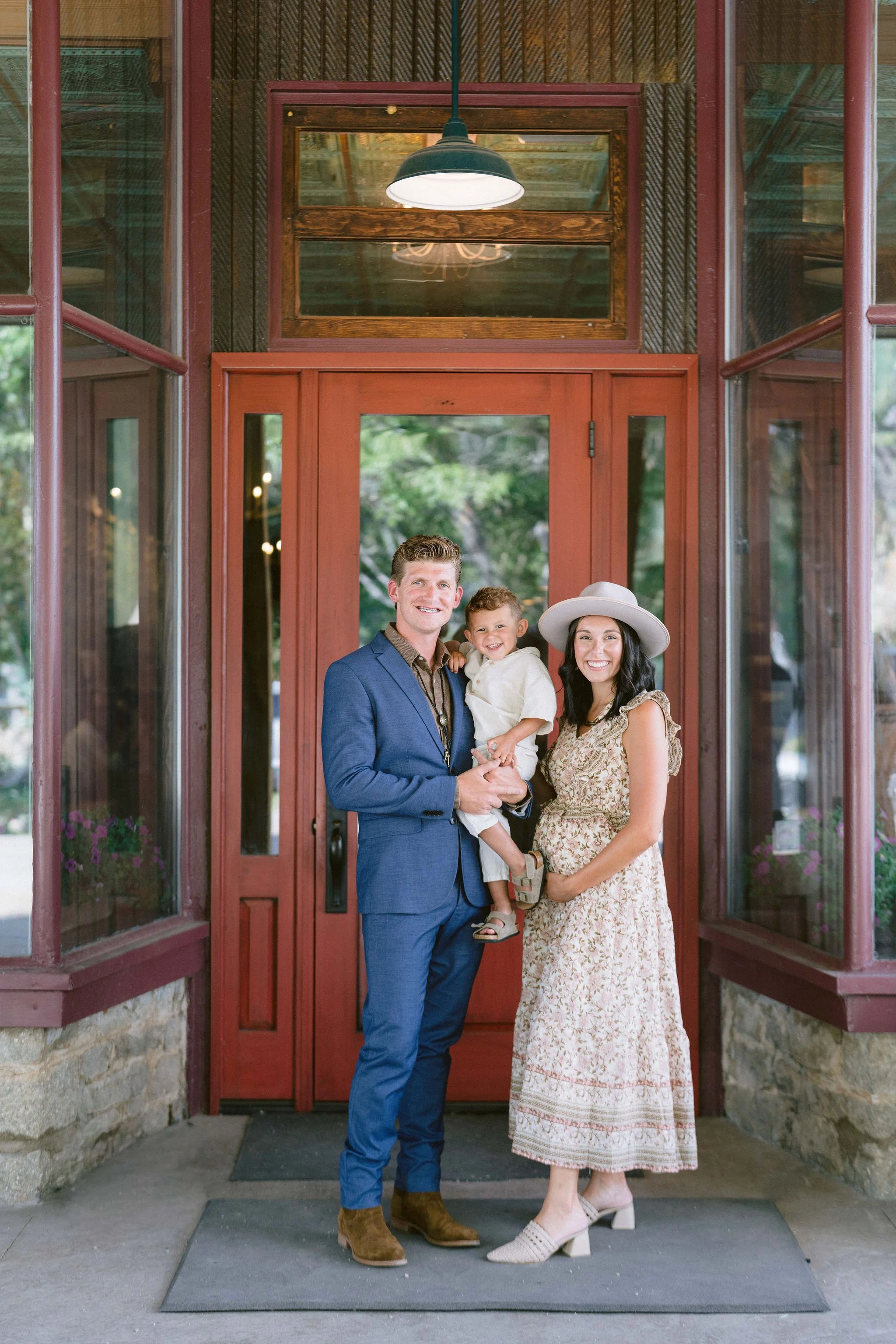 family photo in front of the pitkin hotel for a wedding welcome party