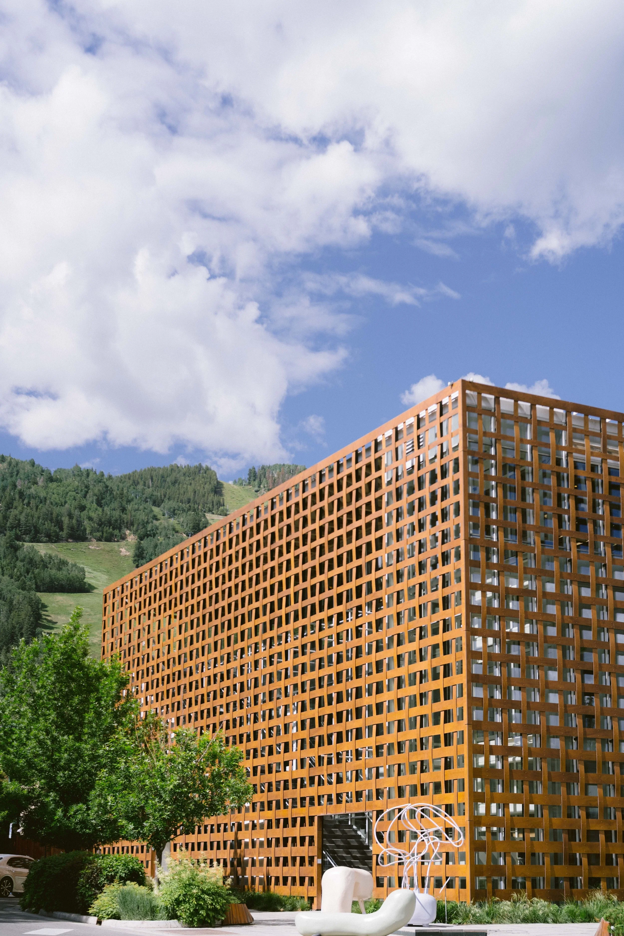The outside of the Aspen Art Museum with Aspen mountain in the background