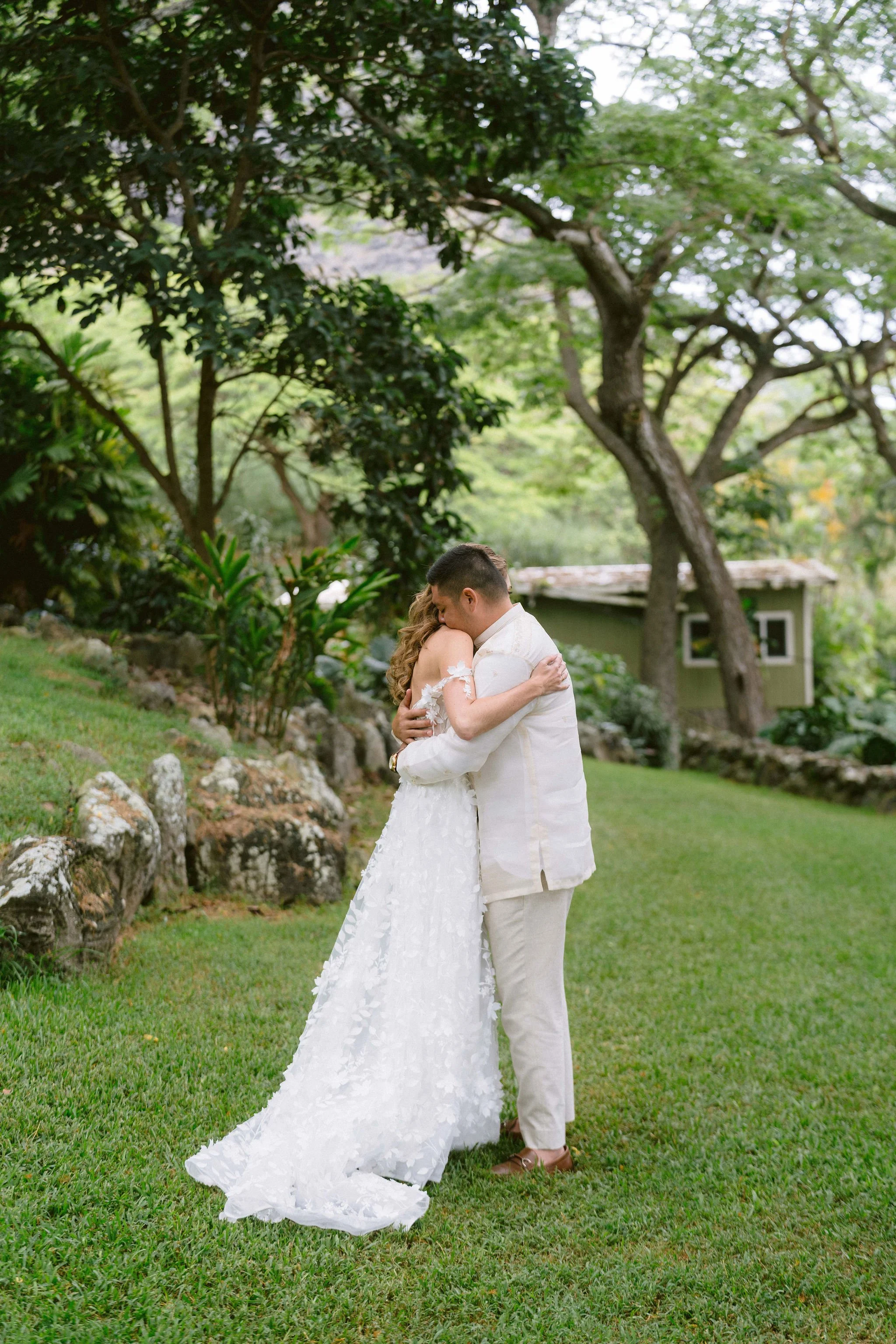 bride and groom embrace during their first look at kualo ranch