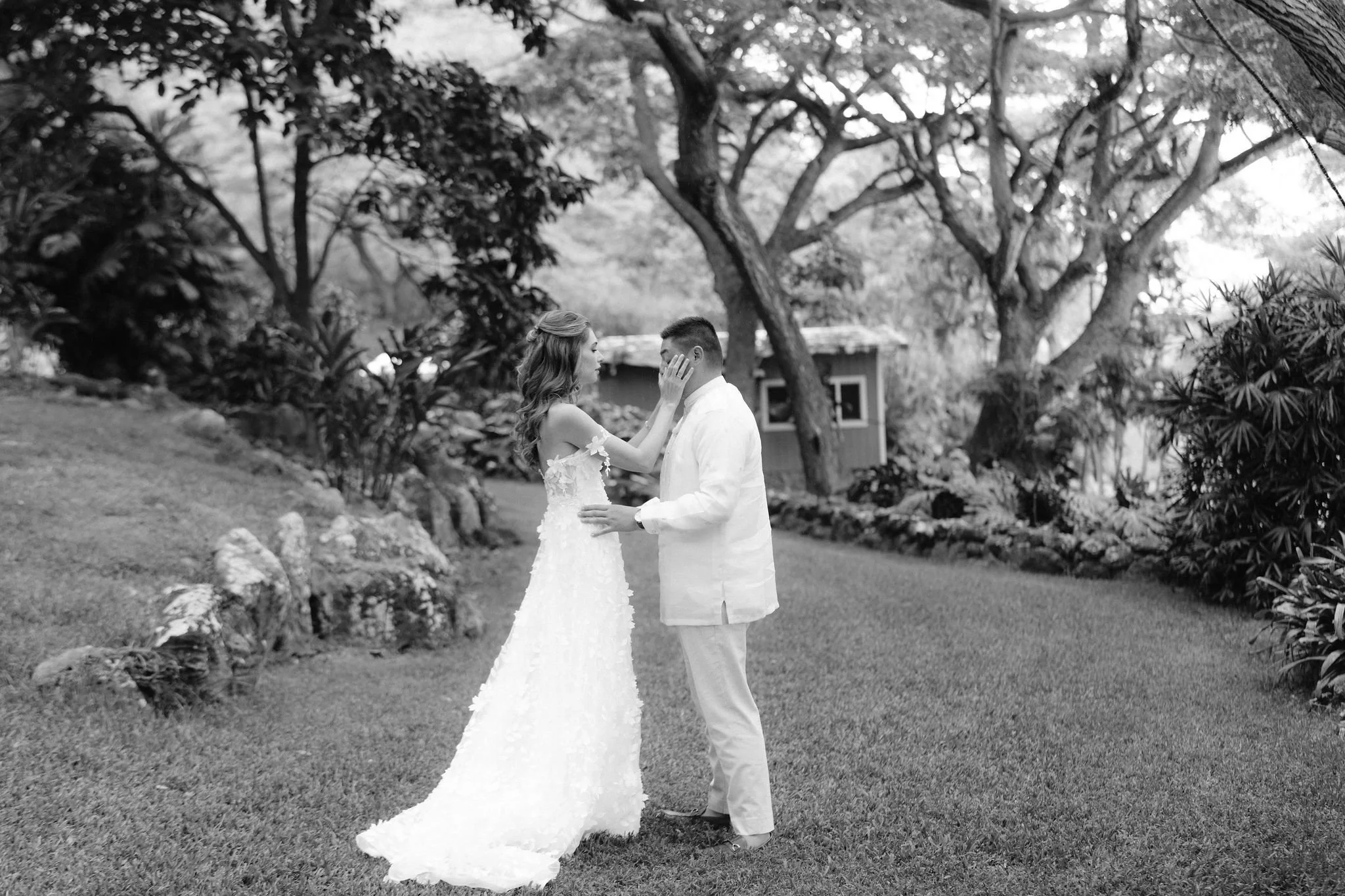 bride wipes tears from groom's eyes during their first look at kualo ranch