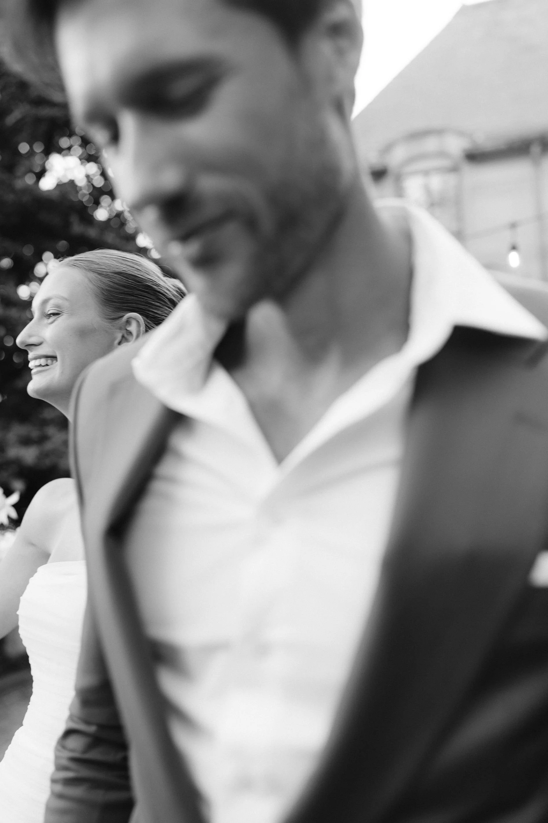bride grins following her husband at their wedding at greencrest manor