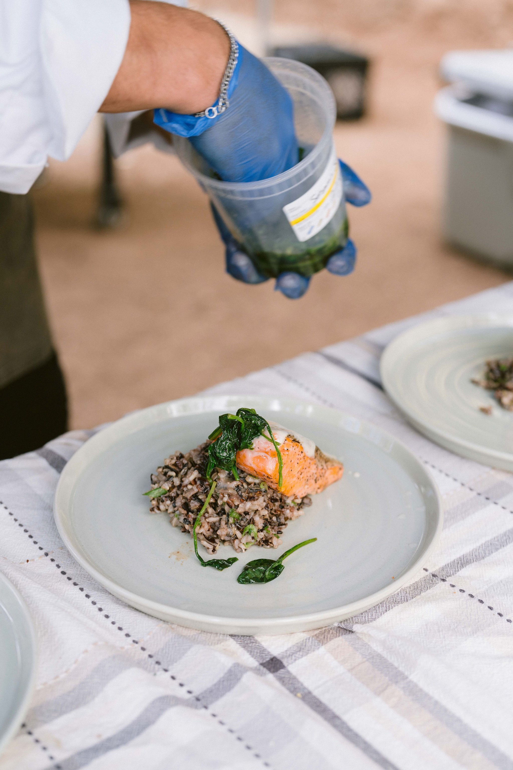 private chef plates fresh caught trout dinner for wedding reception