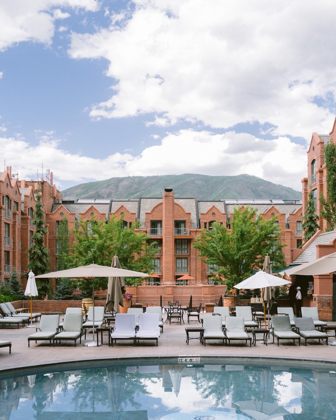 St Regis Aspen's poolside courtyard as well as the courtyard where they host weddings in the summer