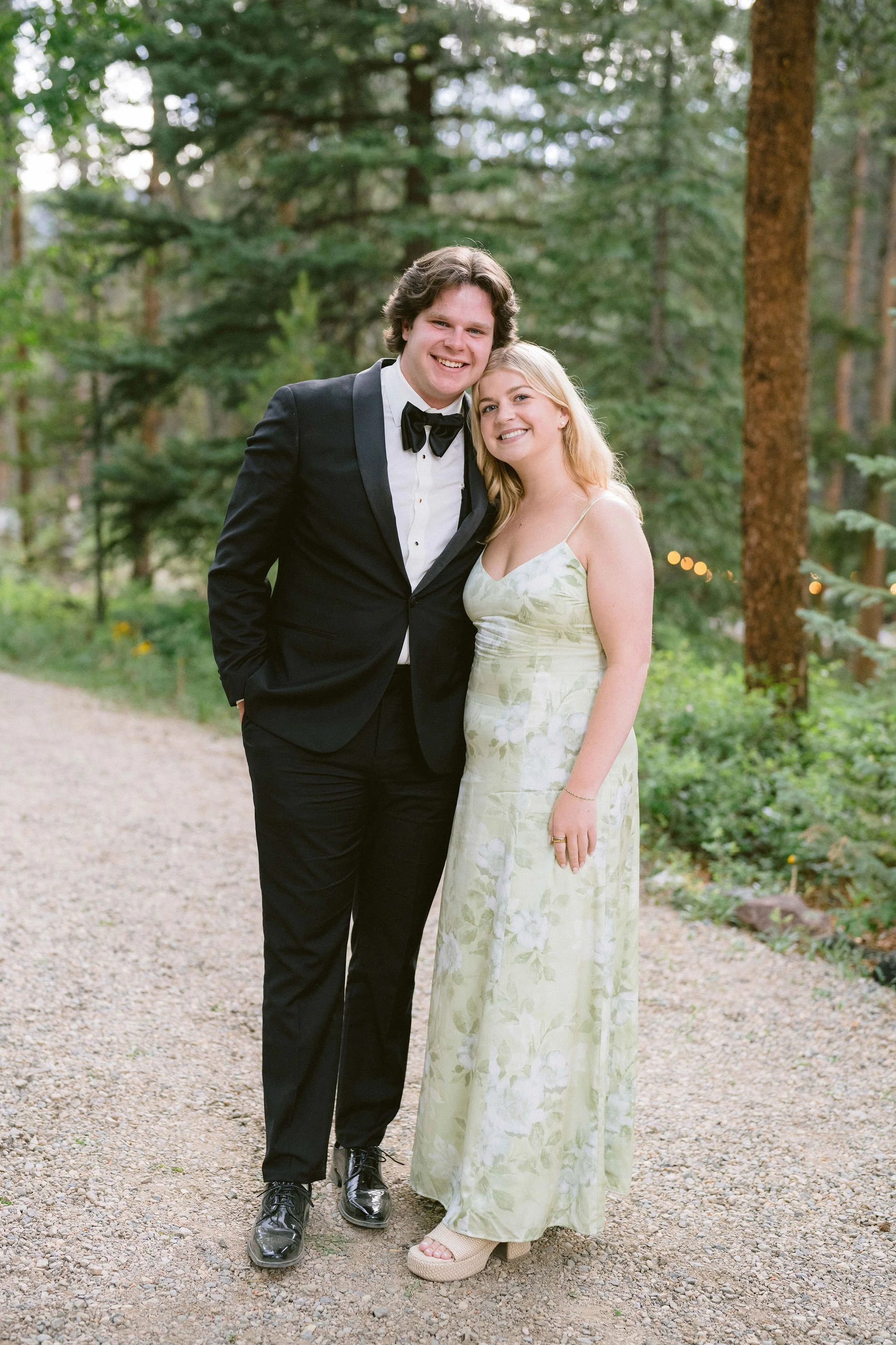 couple poses for photo together during cocktail hour in pitkin colorado