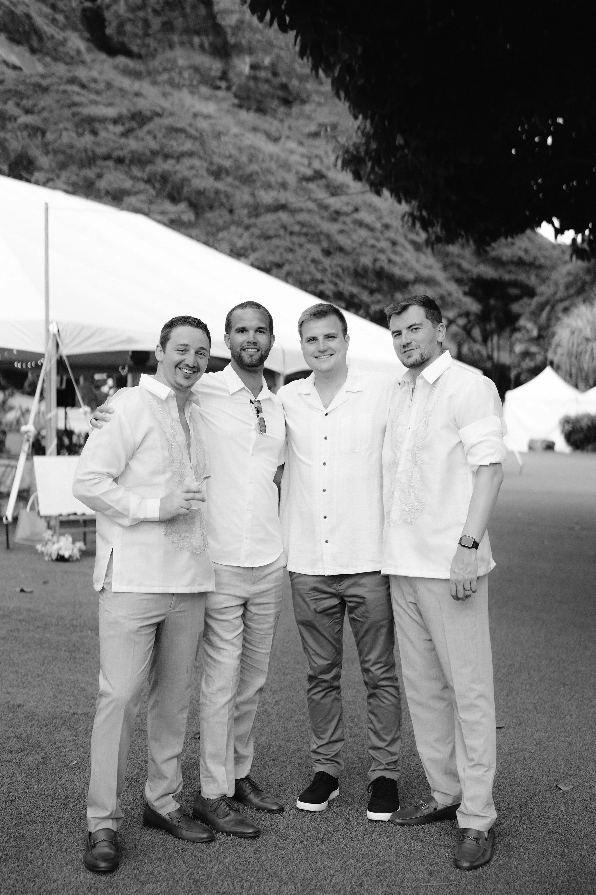 friends of the couple enjoy cocktail hour at kualoa ranch