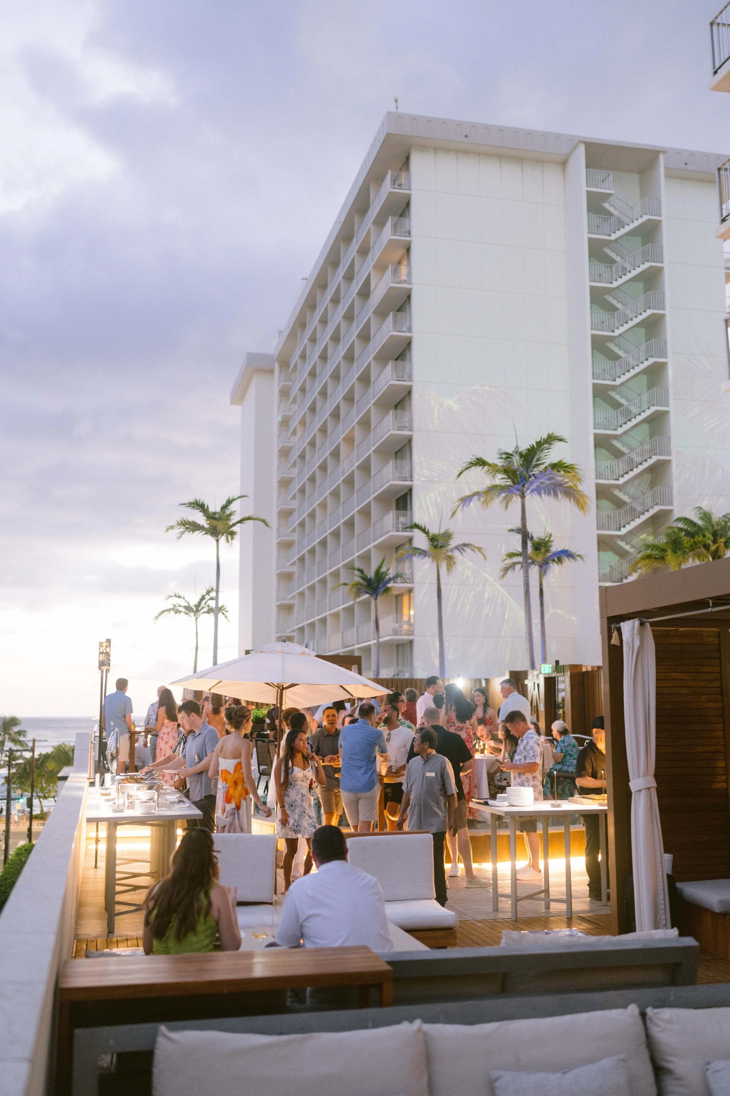 sunset from the rooftop of alohilani resort wedding welcome party