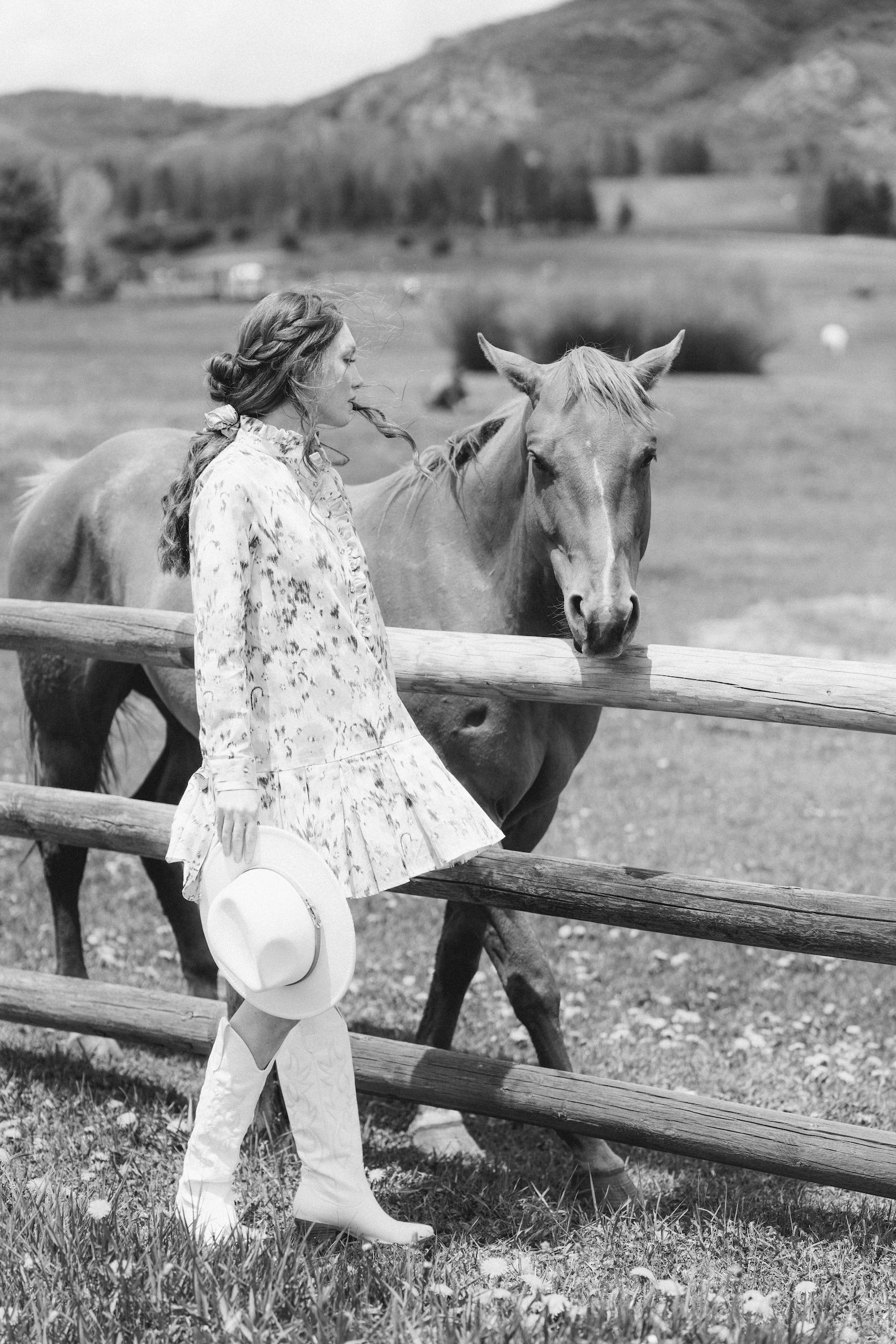 Girl and her horse walking the fence line at Chaparral Ranch in Aspen