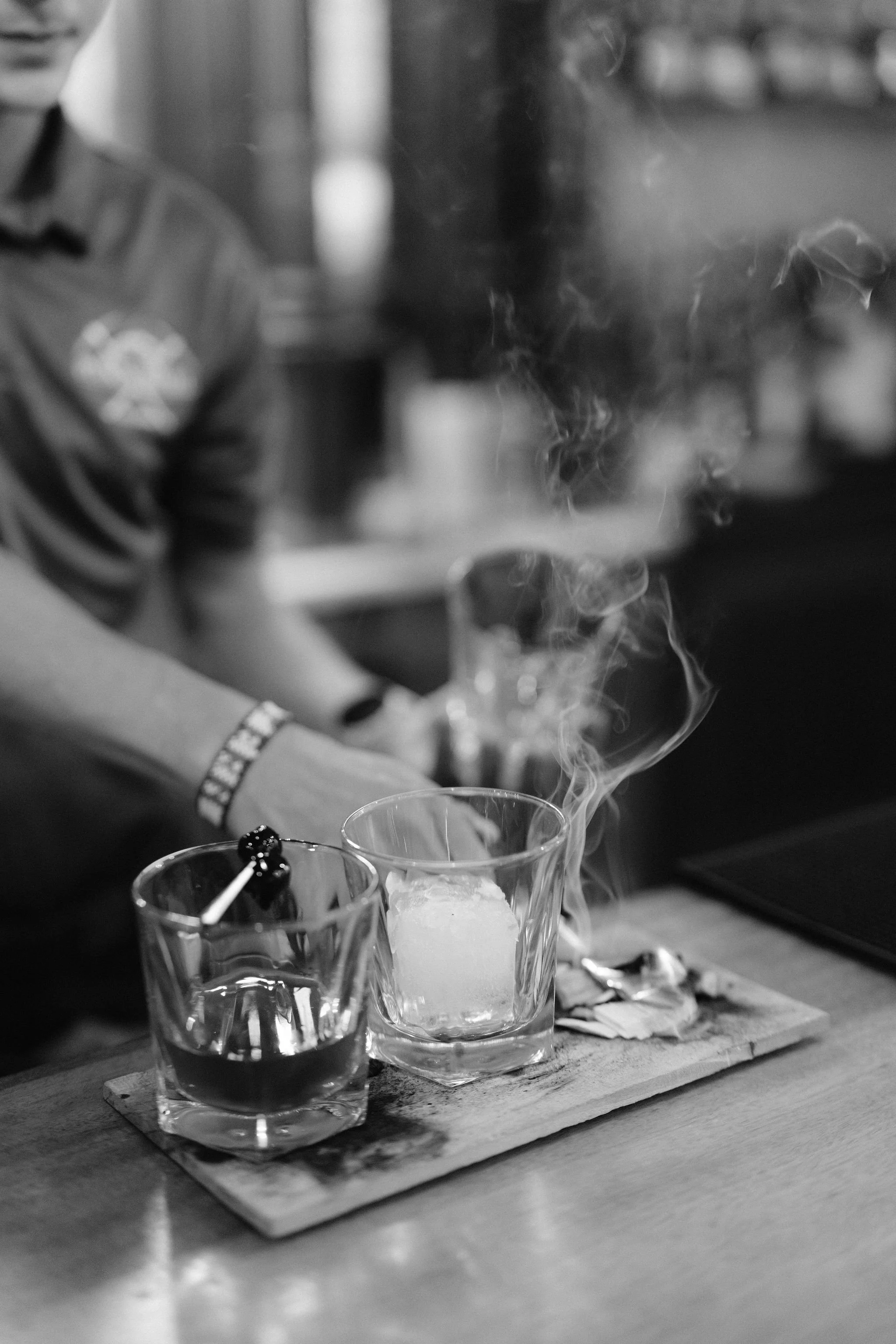 smoky old fashion being made at the bar at the pitkin hotel