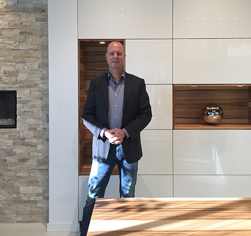 Manfred van Ginkel pictured in front of Warendorf's Matt Sweet Gum veneer with White High Gloss lacquer.