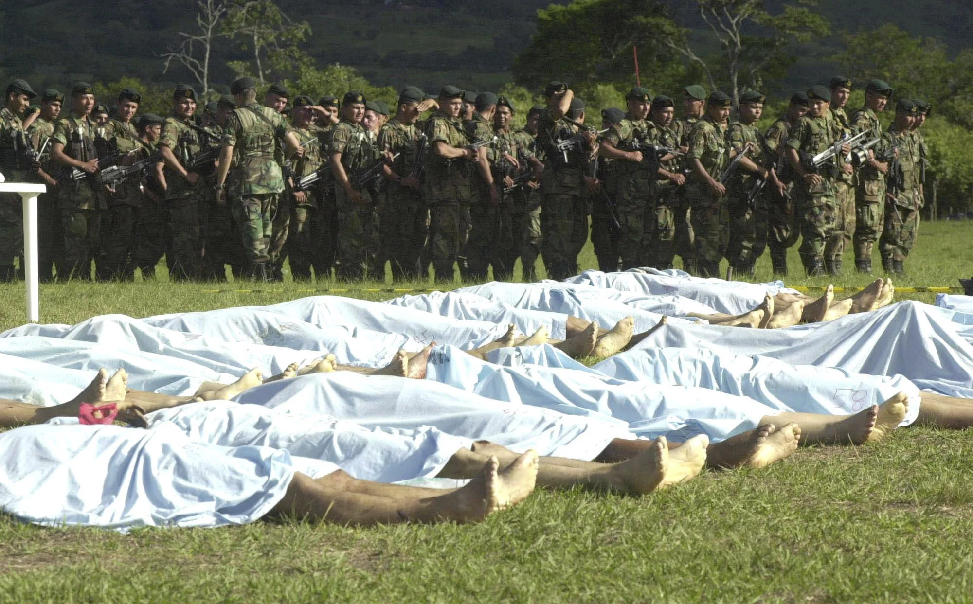 Soldiers show the press 30 dead of Revolutionary Armed Forces of Colombia,FARC, in La Plata, Colombia,2002.