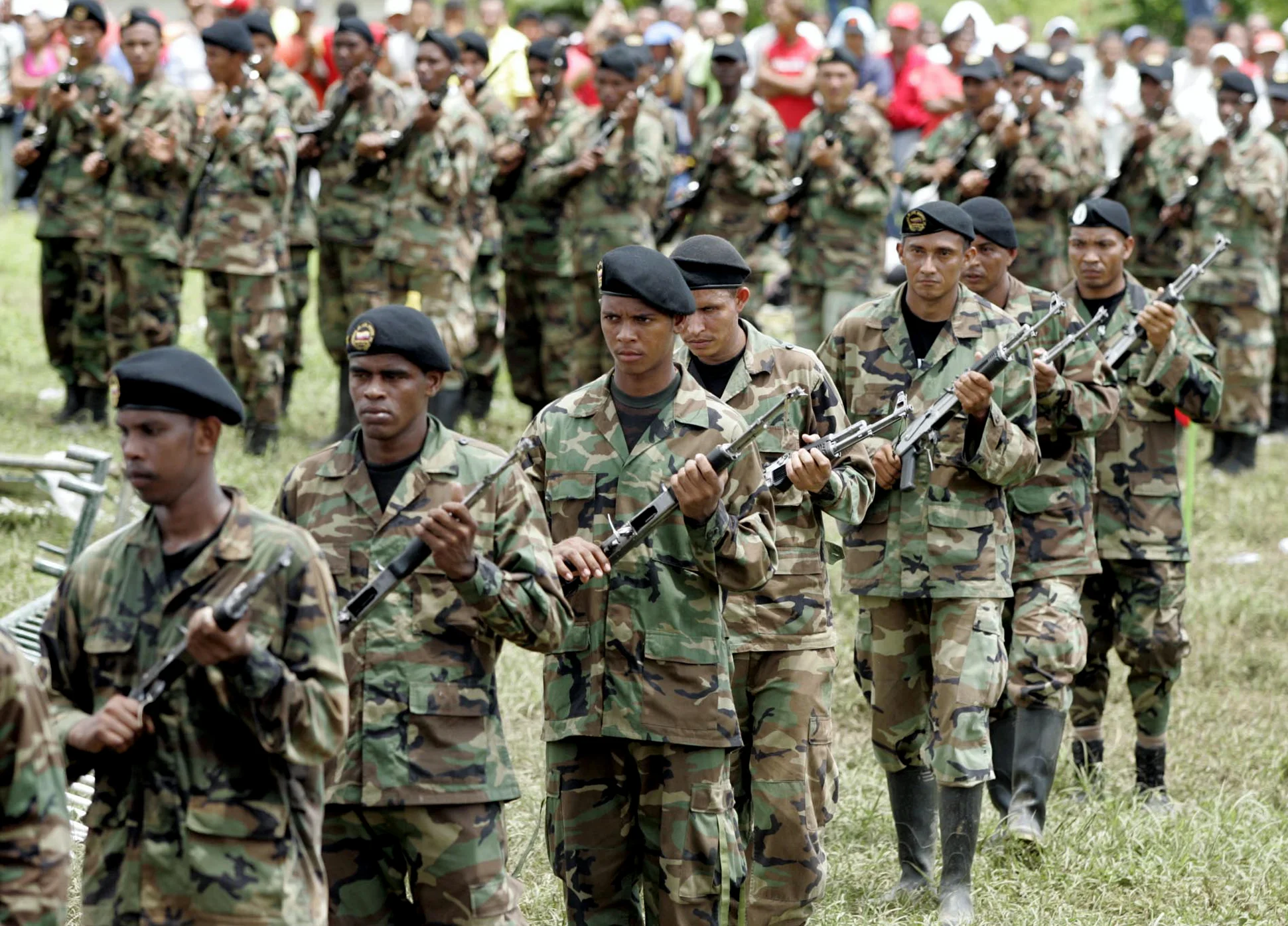 Paramilitary fighters wait to lay down their arms in San Pablo, a town in northern Colombia,2005.