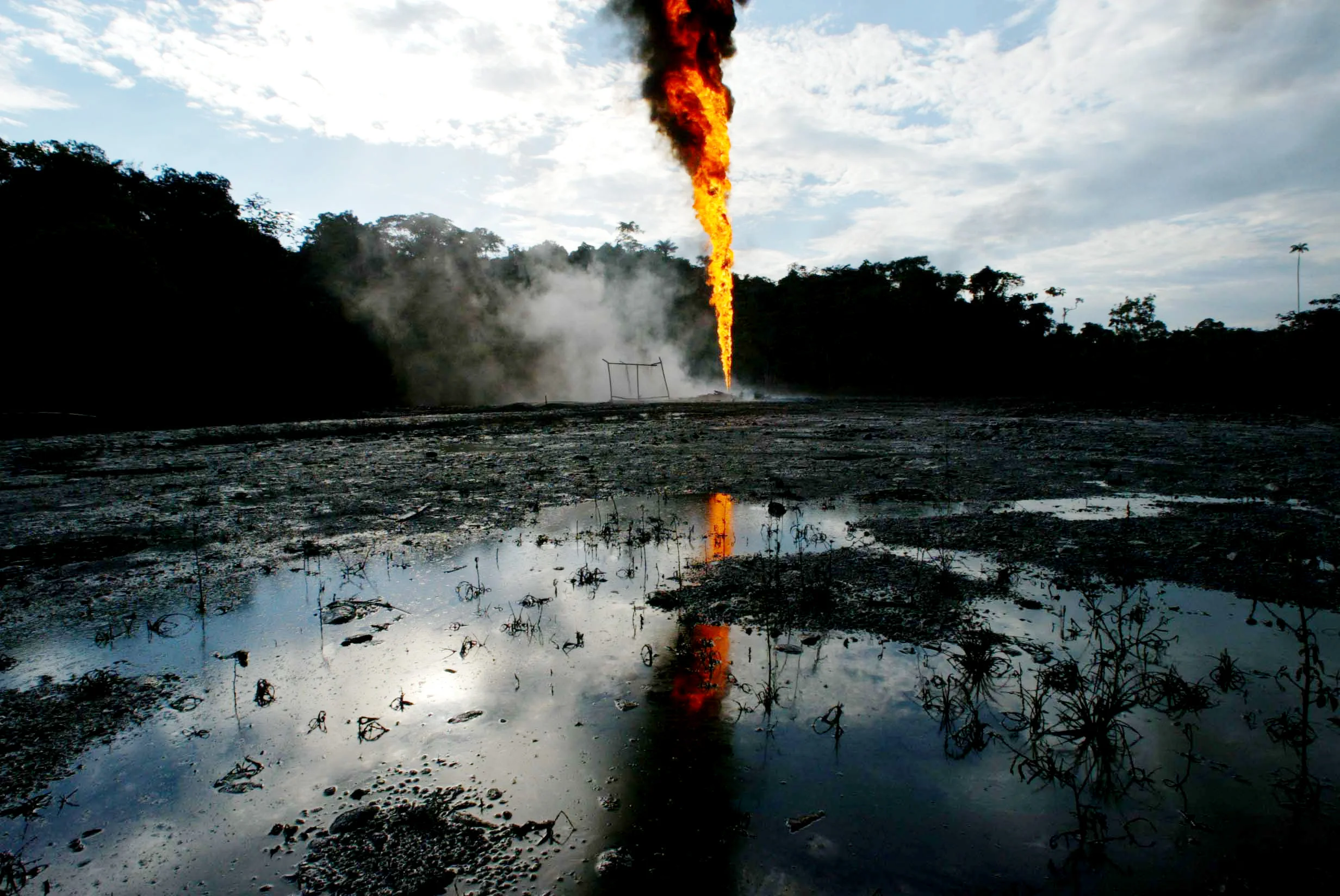 Oil well set ablaze by rebels in the rural area of Puerto Asis, in the jungles of the southern state of Putumayo, 2003.