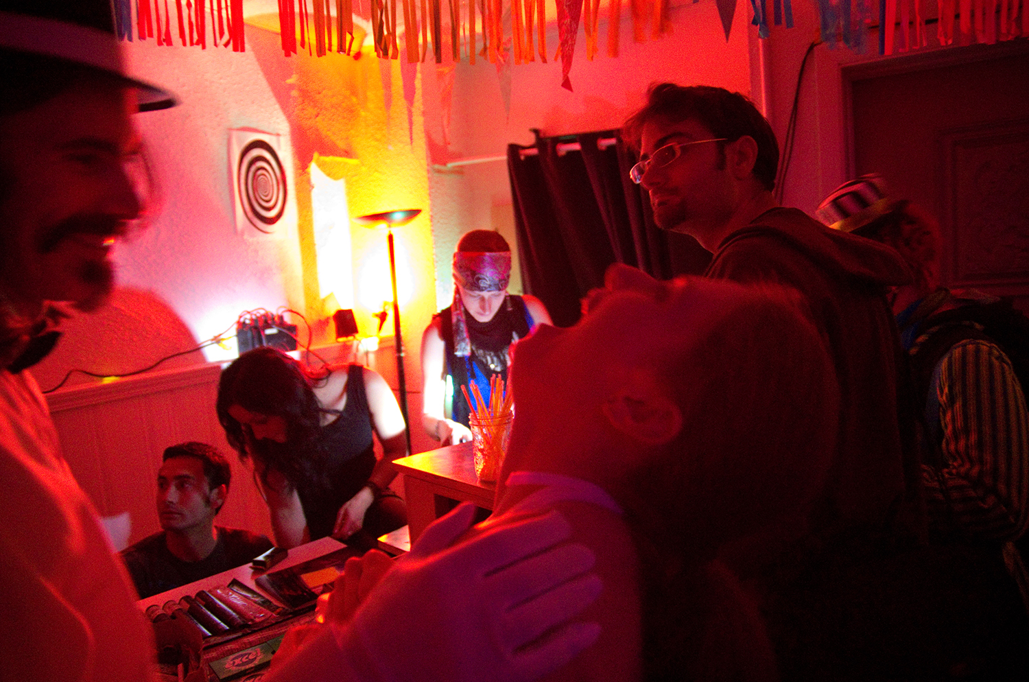 The crew trades off who works the door as partygoers continue to arrive.