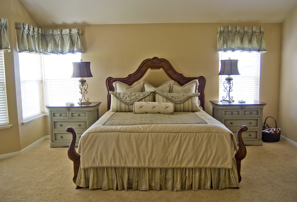 Bed set with hand-stitched pillows, wall hangings, and night stands