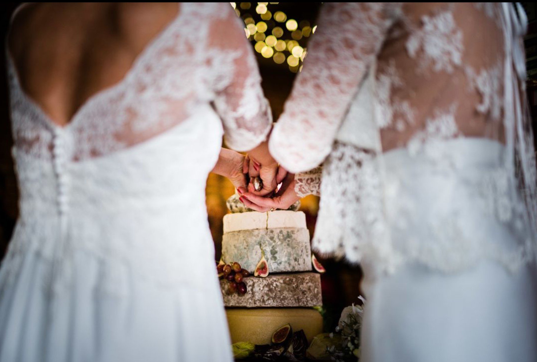 same sex wedding cake cutting.jpg