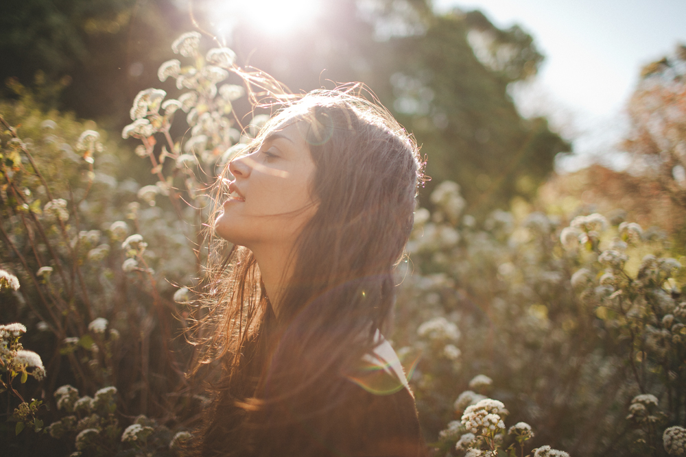  the day my sister graduated from school, we decided to go for a drive to nowhere. we stumbled across this pretty flower field in the setting sun and took pictures. this is me by my sister. 