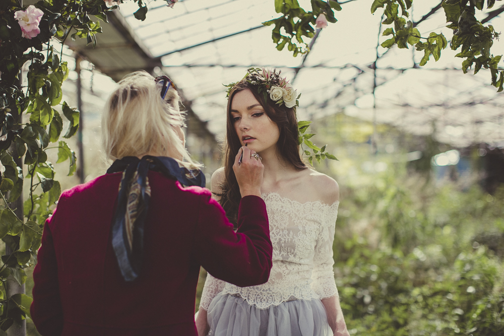  Liv doing makeup touch-ups. 