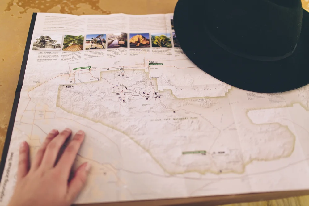  Planning on where to go exploring in Joshua Tree National Park. The heat was too intense during the day so we had to wait until the afternoon to go hiking. 