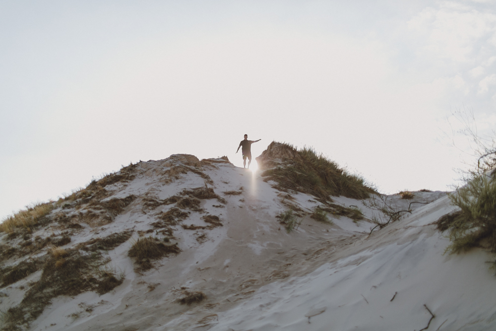  Isaiah about to run and roll down the dunes. 