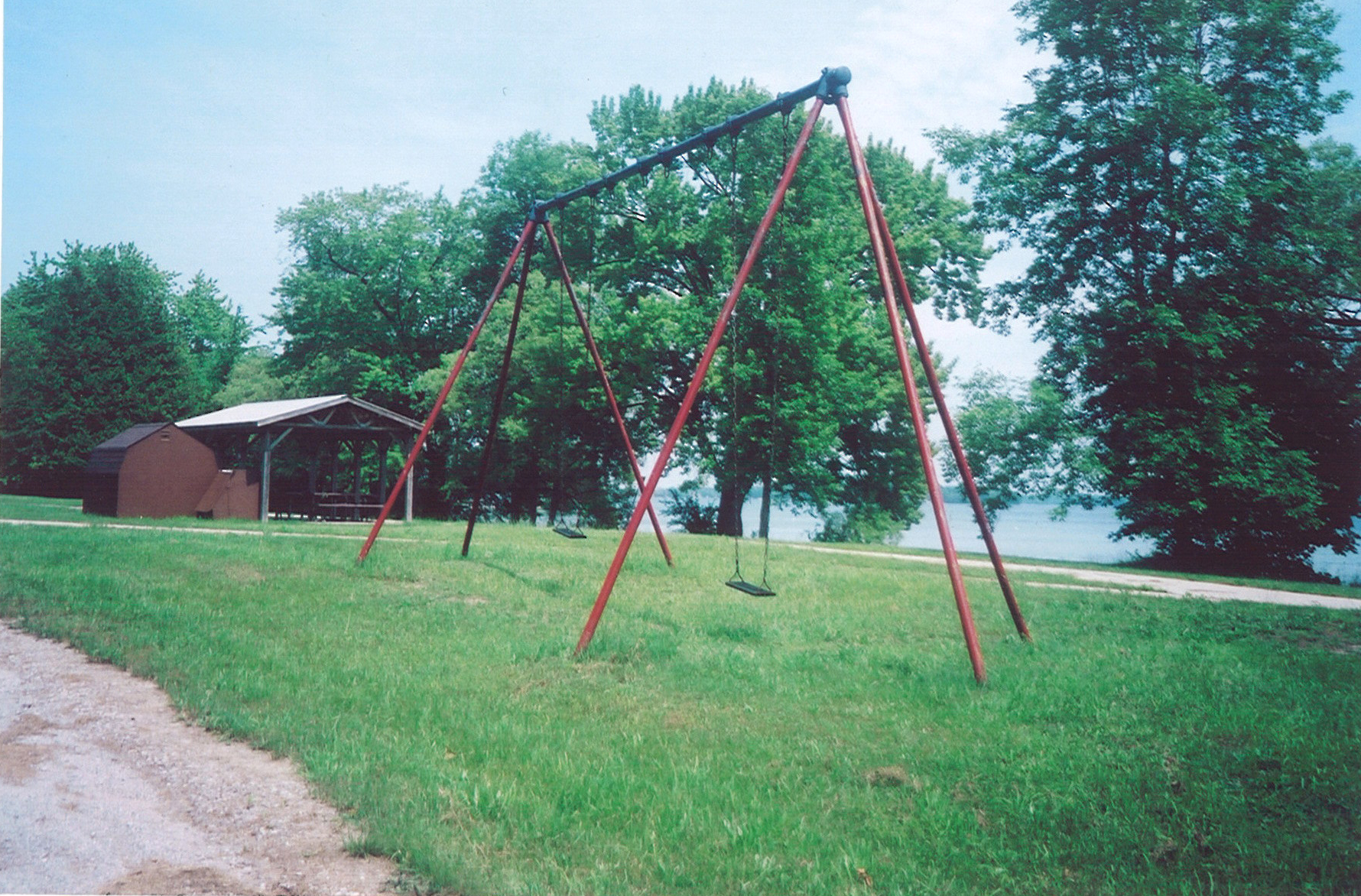 Swings at beach, Lake Simcoe, part of the grounds where children swam and played.