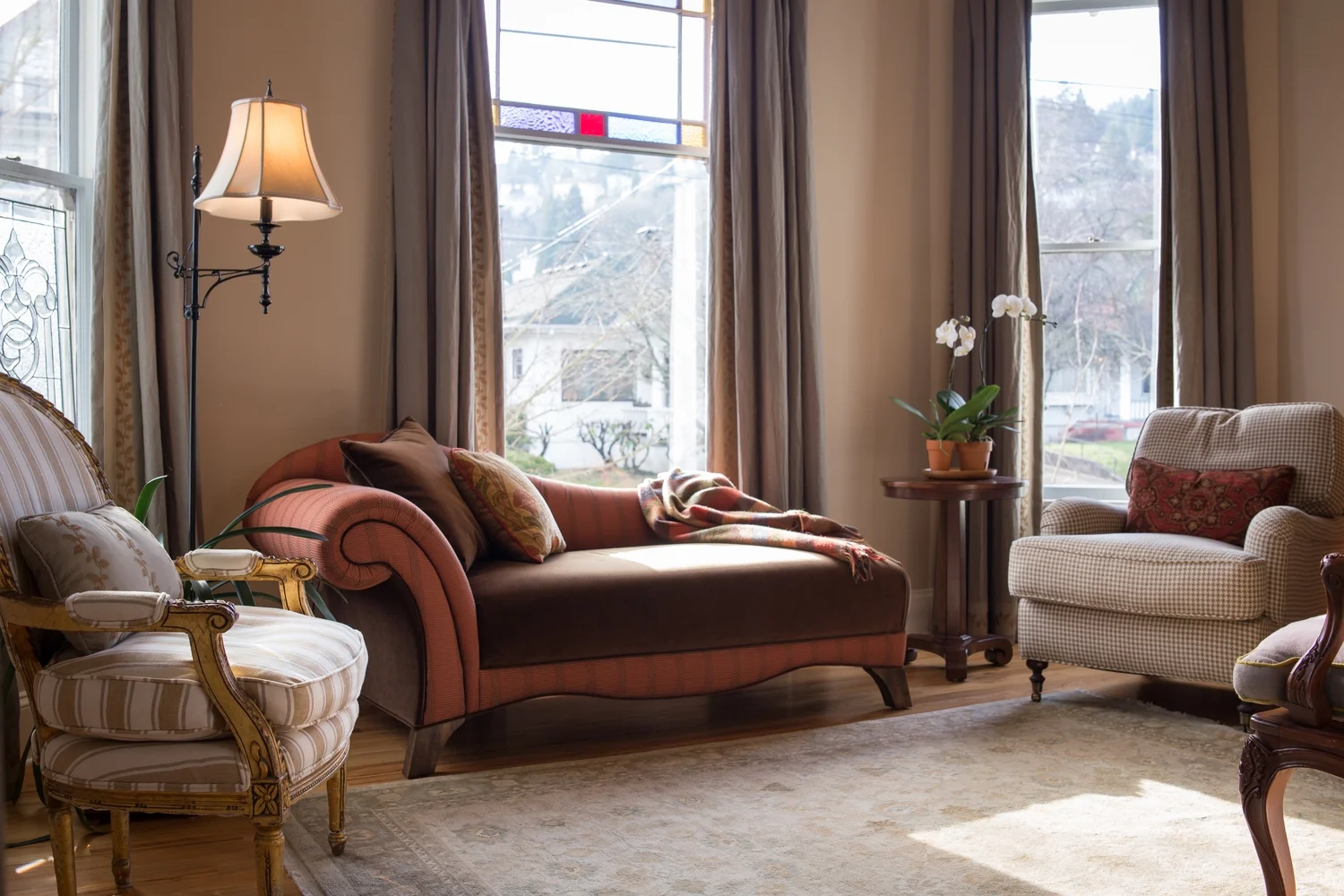 We worked around the homeowners' existing rug and houndstooth chairs to create a warm and welcoming space. 