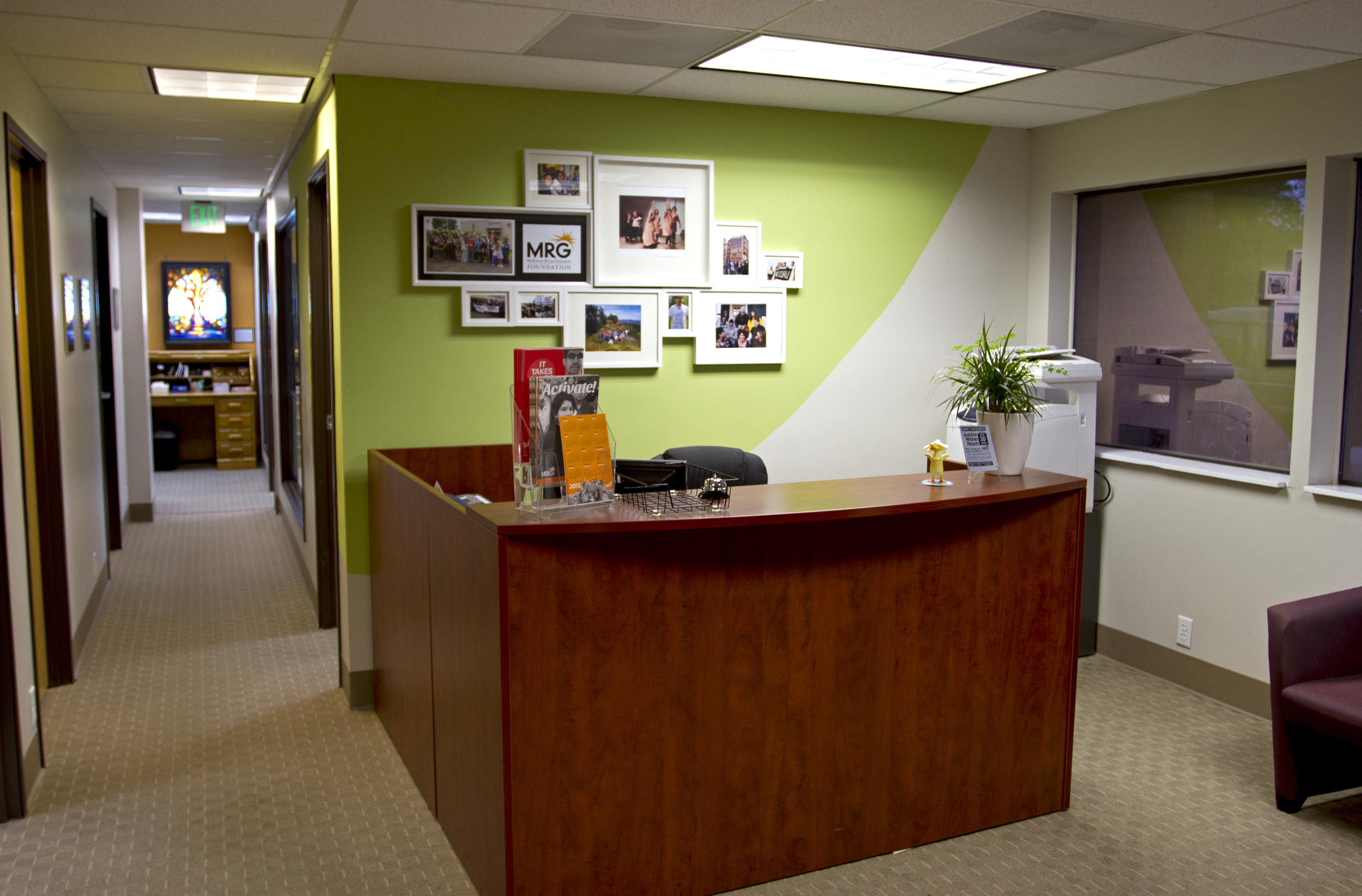  After: the reception area is brightened up with a gallery wall and a splash of color. &nbsp; 