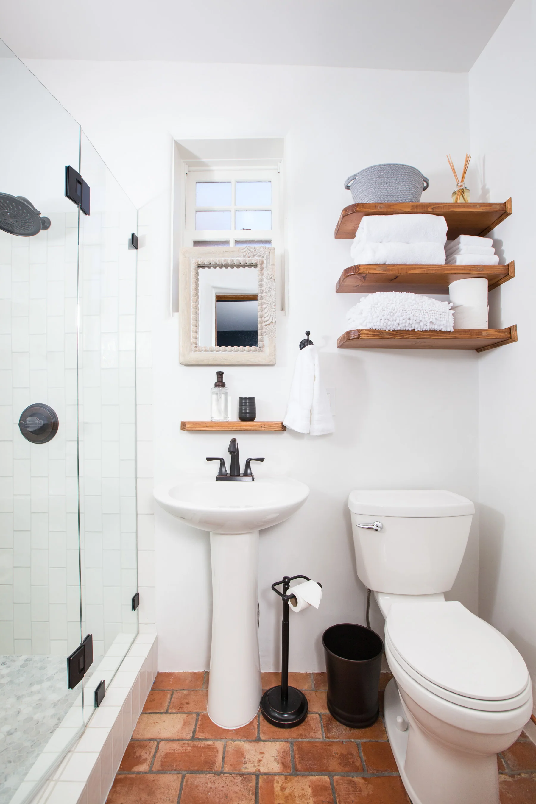 We added a modern rainfall shower head and beautiful marble tile to balance the existing adobe architecture, creating a luxurious experience.